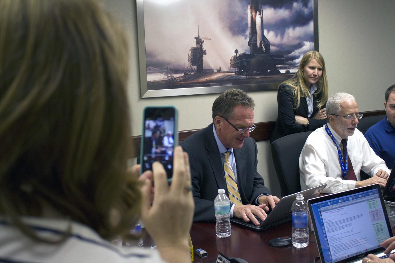 CAPE CANAVERAL, Fla. – NASA managers participate in a live online Ask Me Anything, or AMA, session for reddit.com followers during Orion preflight activities at NASA Kennedy Space Center's News Center in Florida. From left, are Mike Bolger, Ground Systems Development and Operations program manager and Mark Geyer, Orion program manager. Also participating, but not shown in the photo is Todd May, Space Launch System program manager. Discussion topics include Mars and technology. Photo credit: NASA/Frankie Martin