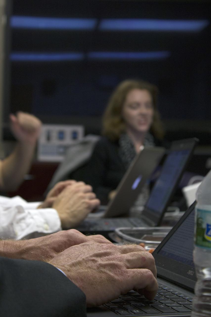 CAPE CANAVERAL, Fla. – NASA managers participate in a live online Ask Me Anything, or AMA, session for reddit.com followers during Orion preflight activities at NASA Kennedy Space Center's News Center in Florida. Participating are Mike Bolger, Ground Systems Development and Operations program manager Mark Geyer, Orion program manager and Todd May, Space Launch System program manager. Discussion topics include Mars and technology. Monitoring the live discussion is Brandi Dean, public affairs specialist from Johnson Space Center in Houston. Photo credit: NASA/Frankie Martin