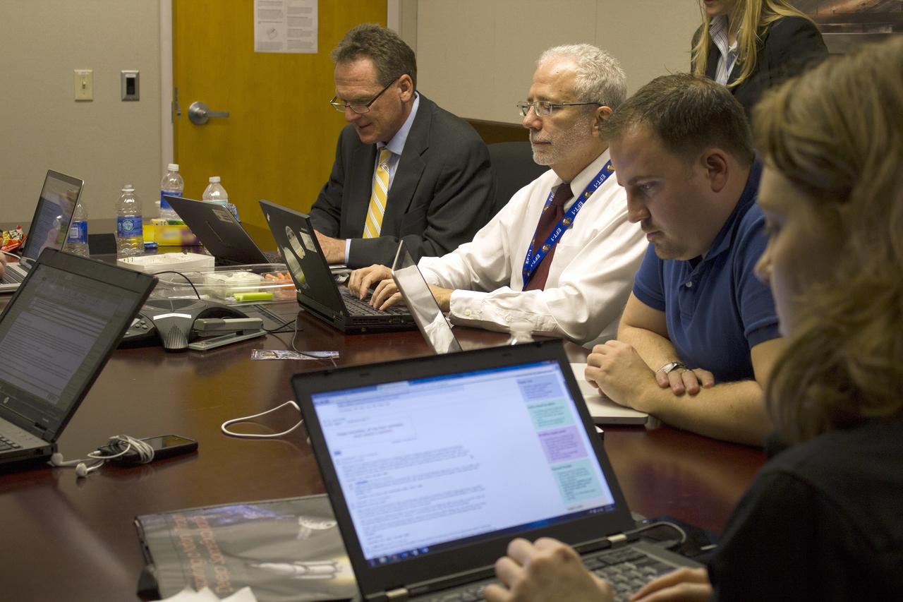 CAPE CANAVERAL, Fla. – From left, Mike Bolger, Ground Systems Development and Operations program manager and Mark Geyer, Orion program manager, participate in a live online Ask Me Anything, or AMA, session for reddit.com followers during Orion preflight activities at NASA Kennedy Space Center's News Center in Florida. Not shown, but also participating is Todd May, Space Launch System program manager. Discussion topics include Mars and technology. Photo credit: NASA/Frankie Martin