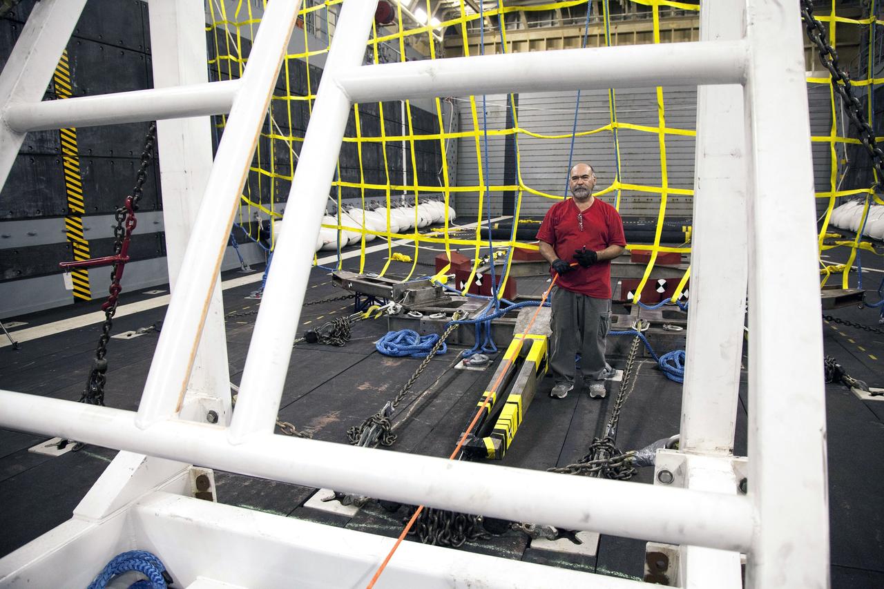 SAN DIEGO, Calif. – NASA, Lockheed Martin and U.S. Navy personnel are preparing the well deck of the USS Anchorage in the Pacific Ocean near the Orion recovery site ahead of the first flight test. The team is preparing for recovery of the crew module, forward bay cover and parachutes on its return from space and splashdown in the Pacific Ocean. The Ground Systems Development and Operations Program is leading the recovery efforts.    The first unpiloted flight test of Orion is scheduled to launch this week atop a United Launch Alliance Delta IV Heavy rocket. During its two-orbit, 4.5-hour flight, Orion will venture 3,600 miles in altitude and travel nearly 60,000 miles before returning to Earth for a splashdown in the Pacific Ocean. For more information, visit http://www.nasa.gov/orion. Photo credit: NASA/Cory Huston