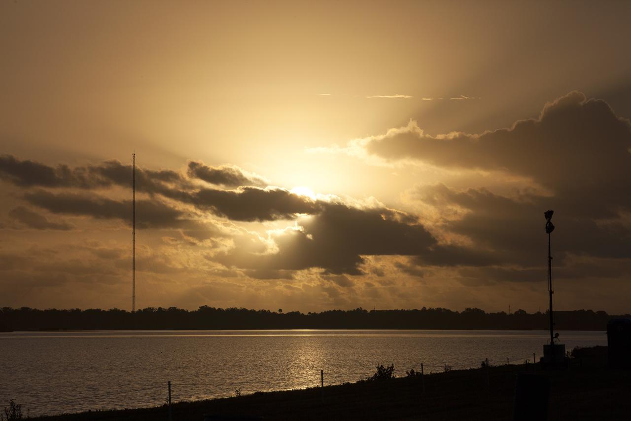 CAPE CANAVERAL, Fla. – A spectacular sunrise at NASA's Kennedy Space Center in Florida heralds the arrival of a new era in exploration a day before the launch of a United Launch Alliance Delta IV Heavy topped by the agency's Orion spacecraft for its first flight test. For more information, visit www.nasa.gov/orion. Photo credit: NASA/Kim Shiflett