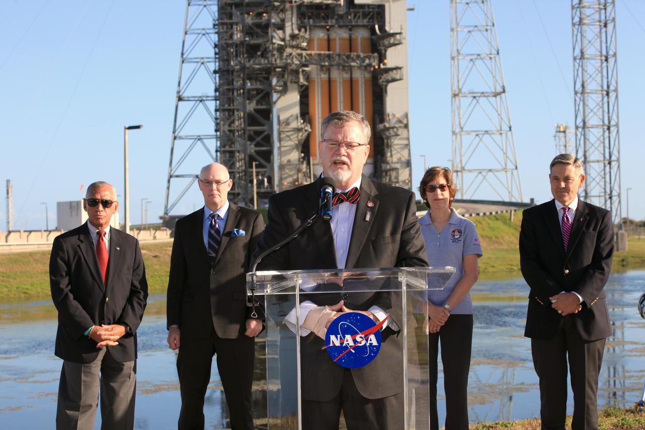 CAPE CANAVERAL, Fla. – At Cape Canaveral Air Force Station's Launch Complex 37, Lockheed Martin Orion Program manager Mike Hawes speaks to members of the news media as the Orion spacecraft and its United Launch Alliance Delta IV Heavy rocket were being prepared for launch. Behind Hawes, from the left, are NASA Administrator Charlie Bolden, United Launch Alliance CEO Tory Bruno, Johnson Space Center Director Ellen Ochoa and Kennedy Space Center Director Bob Cabana. For more information, visit www.nasa.gov/orion. Photo credit: NASA/Kim Shiflett