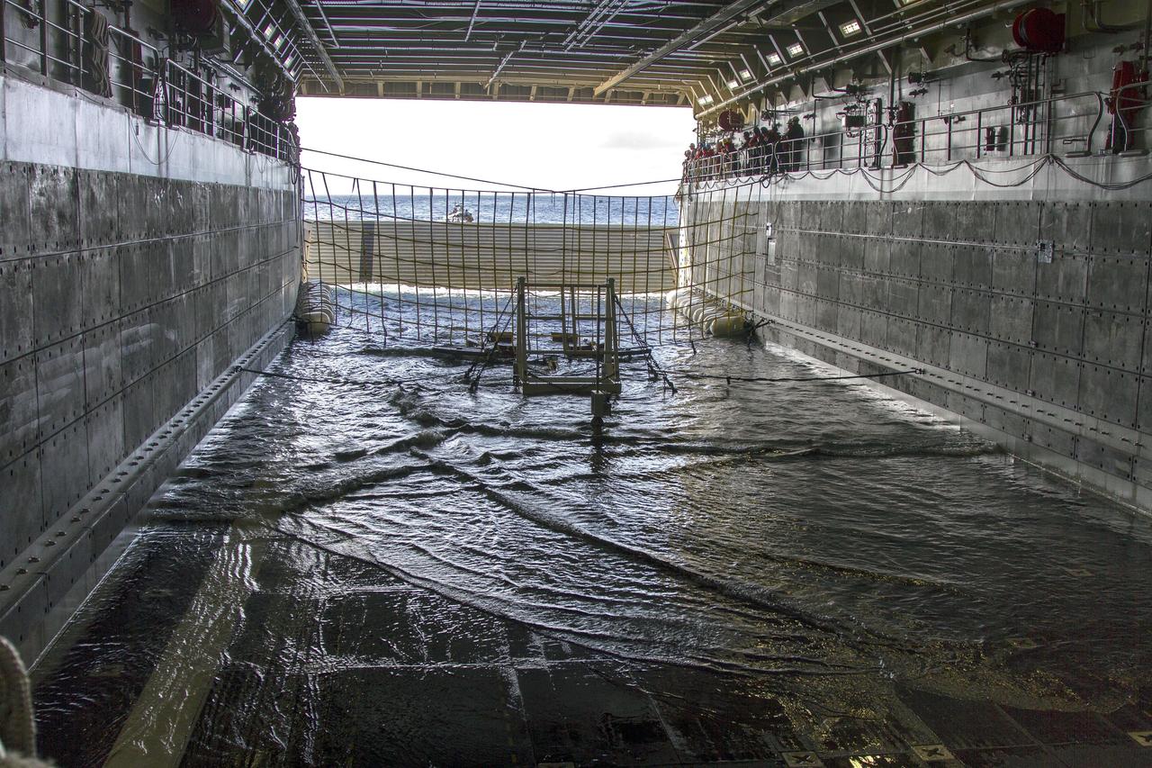 SAN DIEGO, Calif. – On the third day of preparations for recovery of Orion after its splashdown in the Pacific Ocean, the well deck of the USS Anchorage has been filled with water and recovery hardware is in place. The ship is about 600 miles off the coast of Baja, California. NASA, Lockheed Martin and U.S. Navy personnel are preparing for recovery of the crew module, forward bay cover and parachutes on its return from space and splashdown in the Pacific Ocean. The Ground Systems Development and Operations Program is leading the recovery efforts.    The first unpiloted flight test of Orion is scheduled to launch Dec. 4 atop a United Launch Alliance Delta IV Heavy rocket. During its two-orbit, 4.5-hour flight, Orion will venture 3,600 miles in altitude and travel nearly 60,000 miles before returning to Earth for a splashdown in the Pacific Ocean. For more information, visit http://www.nasa.gov/orion. Photo credit: NASA/Cory Huston