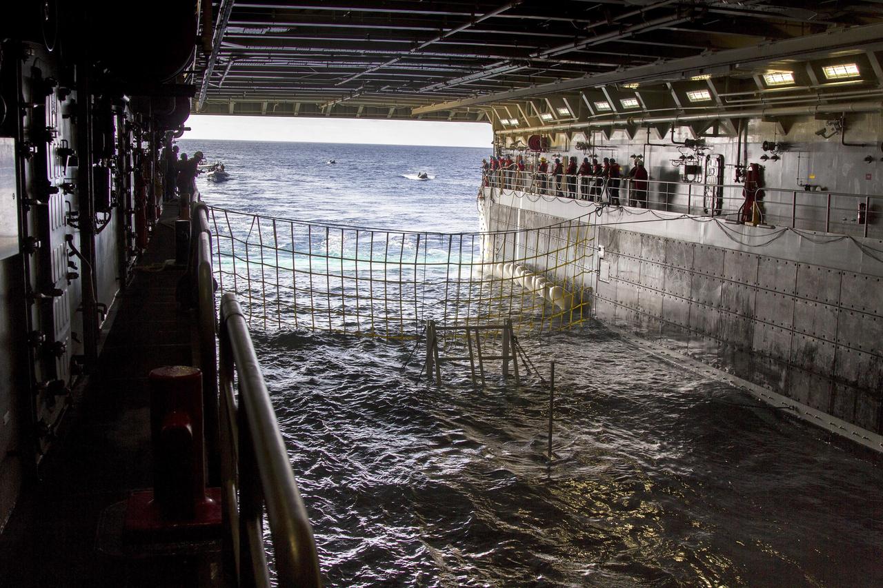 SAN DIEGO, Calif. – On the third day of preparations for recovery of Orion after its splashdown in the Pacific Ocean, the well deck of the USS Anchorage has been filled with water and recovery hardware is in place. U.S. Navy divers have embarked from ship to practice recovery procedures in rigid hull inflatable boats and Zodiac boats. NASA, Lockheed Martin and U.S. Navy personnel are preparing for recovery of the crew module, forward bay cover and parachutes on its return from space and splashdown in the Pacific Ocean. The Ground Systems Development and Operations Program is leading the recovery efforts.    The first unpiloted flight test of Orion is scheduled to launch Dec. 4 atop a United Launch Alliance Delta IV Heavy rocket. During its two-orbit, 4.5-hour flight, Orion will venture 3,600 miles in altitude and travel nearly 60,000 miles before returning to Earth for a splashdown in the Pacific Ocean. For more information, visit http://www.nasa.gov/orion. Photo credit: NASA/Cory Huston