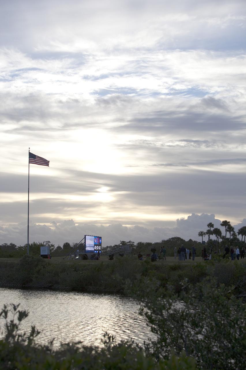 CAPE CANAVERAL, Fla. – At NASA's Kennedy Space Center in Florida, the new countdown clock at the spaceport's Press Site is used for the first time as preparations were underway for the Orion Flight Test. The modern, multimedia display is similar to the screens seen at sporting venues. The new screen is nearly 26 feet wide by 7 feet high, a foot taller than the original clock. For more information, visit www.nasa.gov/orion Photo credit: NASA/Frankie Martin