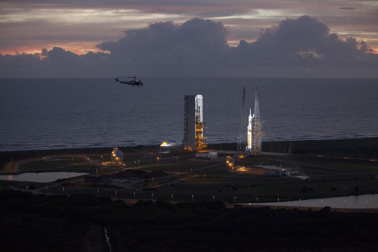 CAPE CANAVERAL, Fla. – This helicopter view of Space Launch Complex 37 at Cape Canaveral Air Force Station in Florida shows the United Launch Alliance Delta IV Heavy rocket as it stands ready to boost NASA's Orion spacecraft on a 4.5-hour mission. The liftoff was postponed because of an issue related to fill and drain valves on the Delta IV Heavy rocket that teams could not troubleshoot by the time the launch window expired. For more information, visit www.nasa.gov/orion Photo credit: NASA/Kim Shiflett