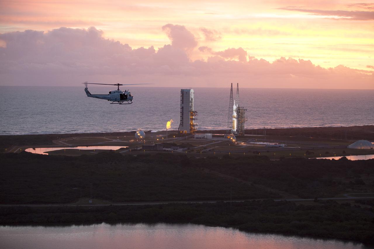 CAPE CANAVERAL, Fla. – This helicopter view of Space Launch Complex 37 at Cape Canaveral Air Force Station in Florida shows the United Launch Alliance Delta IV Heavy rocket as it stands ready to boost NASA's Orion spacecraft on a 4.5-hour mission. The liftoff was postponed because of an issue related to fill and drain valves on the Delta IV Heavy rocket that teams could not troubleshoot by the time the launch window expired. For more information, visit www.nasa.gov/orion Photo credit: NASA/Kim Shiflett