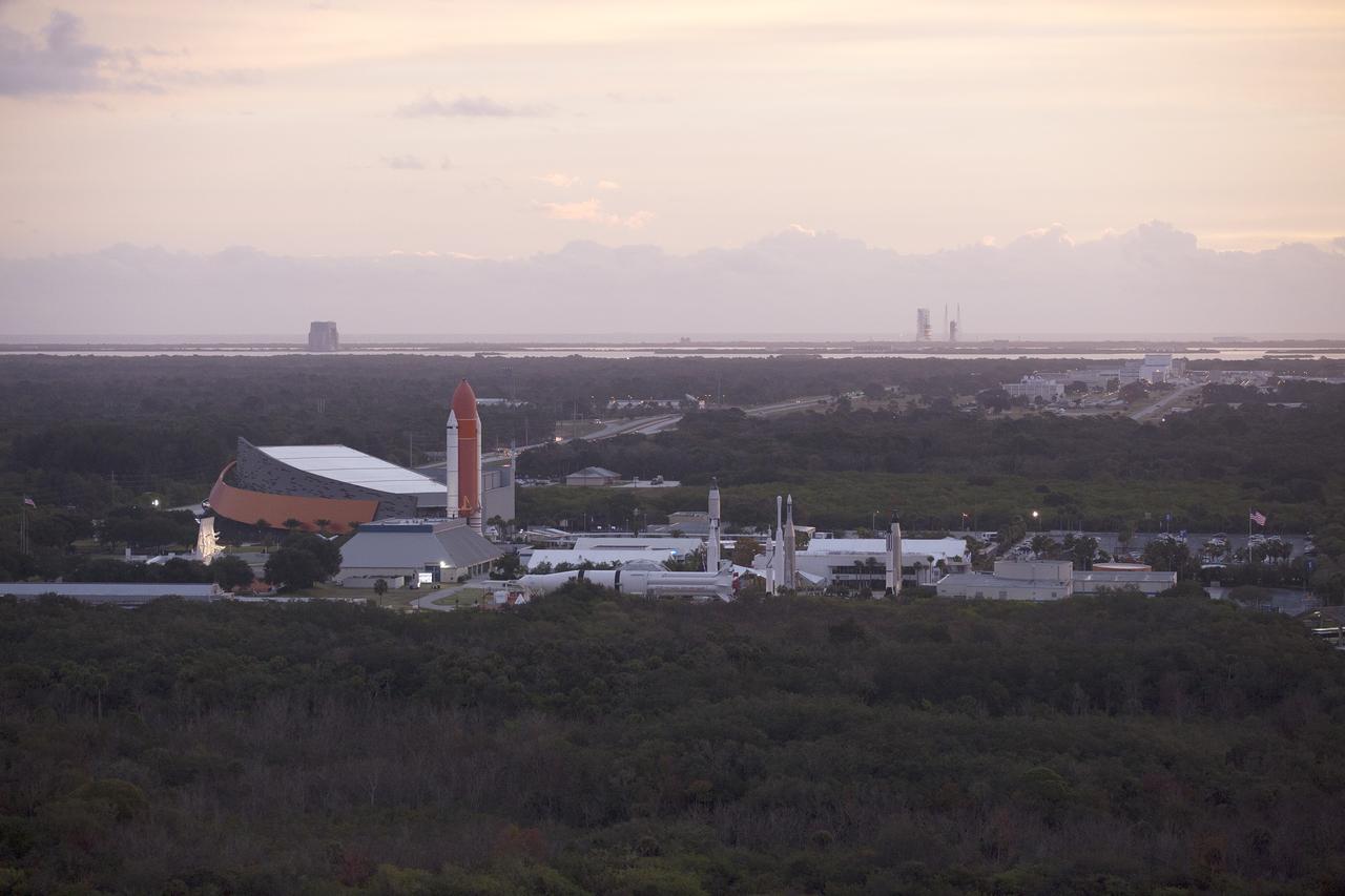 CAPE CANAVERAL, Fla. – This helicopter view of the Kennedy Space Center Visitor Complex shows the thousands of vehicles parked where guests gather to see the launch of the Orion Flight Test. The liftoff was postponed because of an issue related to fill and drain valves on the Delta IV Heavy rocket that teams could not troubleshoot by the time the launch window expired. For more information, visit www.nasa.gov/orion Photo credit: NASA/Kim Shiflett