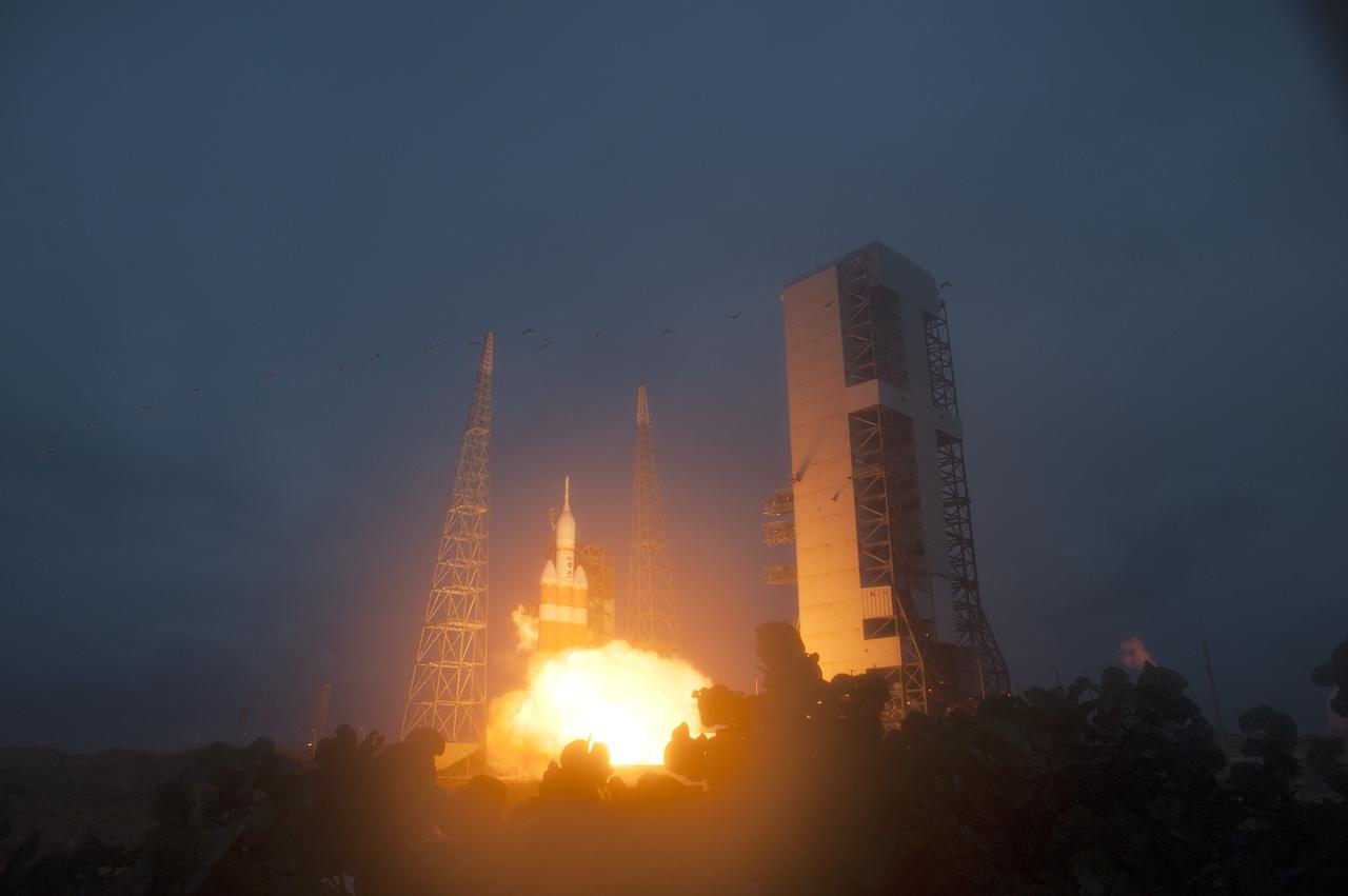 CAPE CANAVERAL, Fla. -- A Delta IV Heavy rocket lifts off from Space Launch Complex 37 at Cape Canaveral Air Force Station in Florida carrying NASA's Orion spacecraft on an unpiloted flight test to Earth orbit. Liftoff was at 7:05 a.m. EST. During the two-orbit, four-and-a-half hour mission, engineers will evaluate the systems critical to crew safety, the launch abort system, the heat shield and the parachute system. Photo credit: NASA/Sandra Joseph and Kevin O'Connell