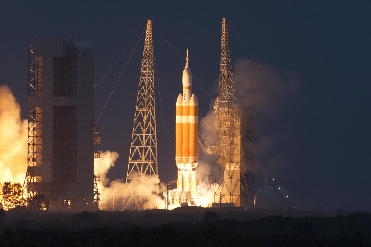 CAPE CANAVERAL, Fla. -- A Delta IV Heavy rocket lifts off from Space Launch Complex 37 at Cape Canaveral Air Force Station in Florida carrying NASA's Orion spacecraft on an unpiloted flight test to Earth orbit. Liftoff was at 7:05 a.m. EST. During the two-orbit, four-and-a-half hour mission, engineers will evaluate the systems critical to crew safety, the launch abort system, the heat shield and the parachute system. Photo credit: NASA/George Roberts