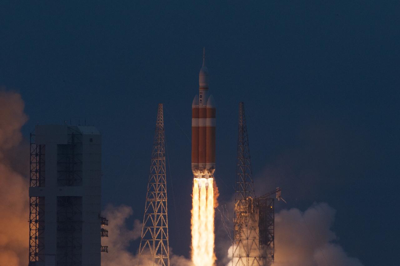 CAPE CANAVERAL, Fla. -- A Delta IV Heavy rocket lifts off from Space Launch Complex 37 at Cape Canaveral Air Force Station in Florida carrying NASA's Orion spacecraft on an unpiloted flight test to Earth orbit. Liftoff was at 7:05 a.m. EST. During the two-orbit, four-and-a-half hour mission, engineers will evaluate the systems critical to crew safety, the launch abort system, the heat shield and the parachute system. Photo credit: NASA/George Roberts
