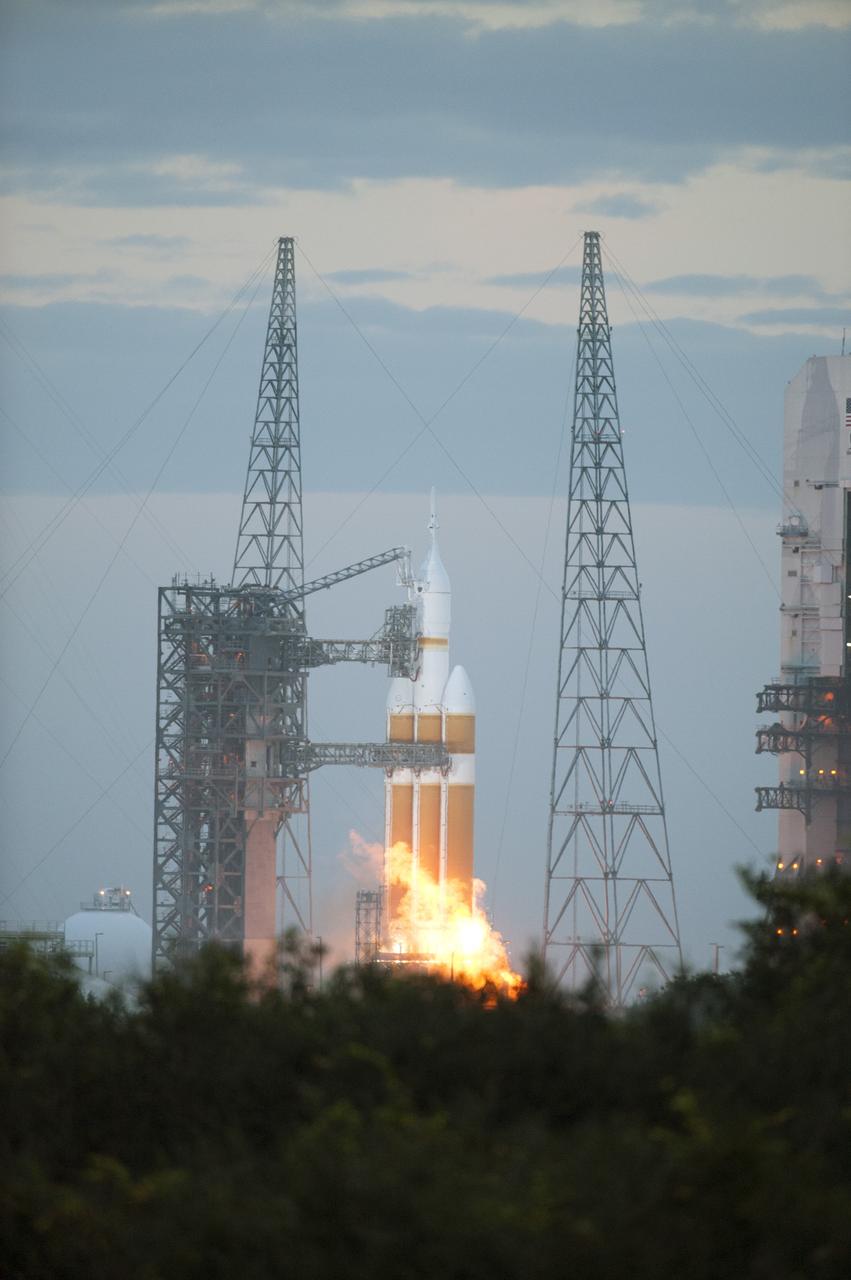 CAPE CANAVERAL, Fla. -- A Delta IV Heavy rocket lifts off from Space Launch Complex 37 at Cape Canaveral Air Force Station in Florida carrying NASA's Orion spacecraft on an unpiloted flight test to Earth orbit. Liftoff was at 7:05 a.m. EST. During the two-orbit, four-and-a-half hour mission, engineers will evaluate the systems critical to crew safety, the launch abort system, the heat shield and the parachute system. For more information, visit www.nasa.gov/orion Photo credit: NASA/Tim Terry