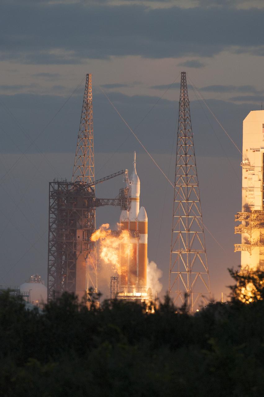 CAPE CANAVERAL, Fla. -- A Delta IV Heavy rocket lifts off from Space Launch Complex 37 at Cape Canaveral Air Force Station in Florida carrying NASA's Orion spacecraft on an unpiloted flight test to Earth orbit. Liftoff was at 7:05 a.m. EST. During the two-orbit, four-and-a-half hour mission, engineers will evaluate the systems critical to crew safety, the launch abort system, the heat shield and the parachute system. For more information, visit www.nasa.gov/orion Photo credit: NASA/Tim Terry