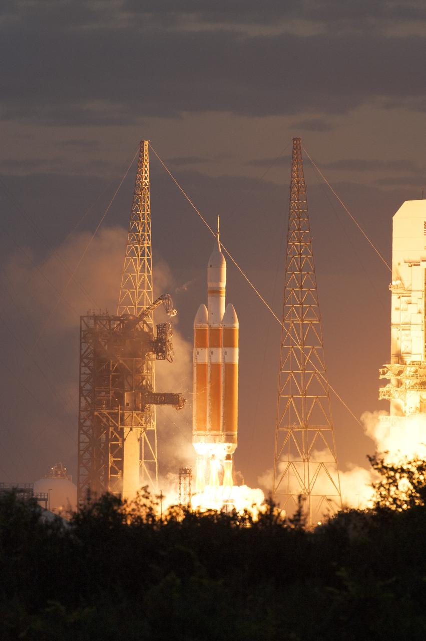 CAPE CANAVERAL, Fla. -- A Delta IV Heavy rocket lifts off from Space Launch Complex 37 at Cape Canaveral Air Force Station in Florida carrying NASA's Orion spacecraft on an unpiloted flight test to Earth orbit. Liftoff was at 7:05 a.m. EST. During the two-orbit, four-and-a-half hour mission, engineers will evaluate the systems critical to crew safety, the launch abort system, the heat shield and the parachute system. For more information, visit www.nasa.gov/orion Photo credit: NASA/Tim Terry