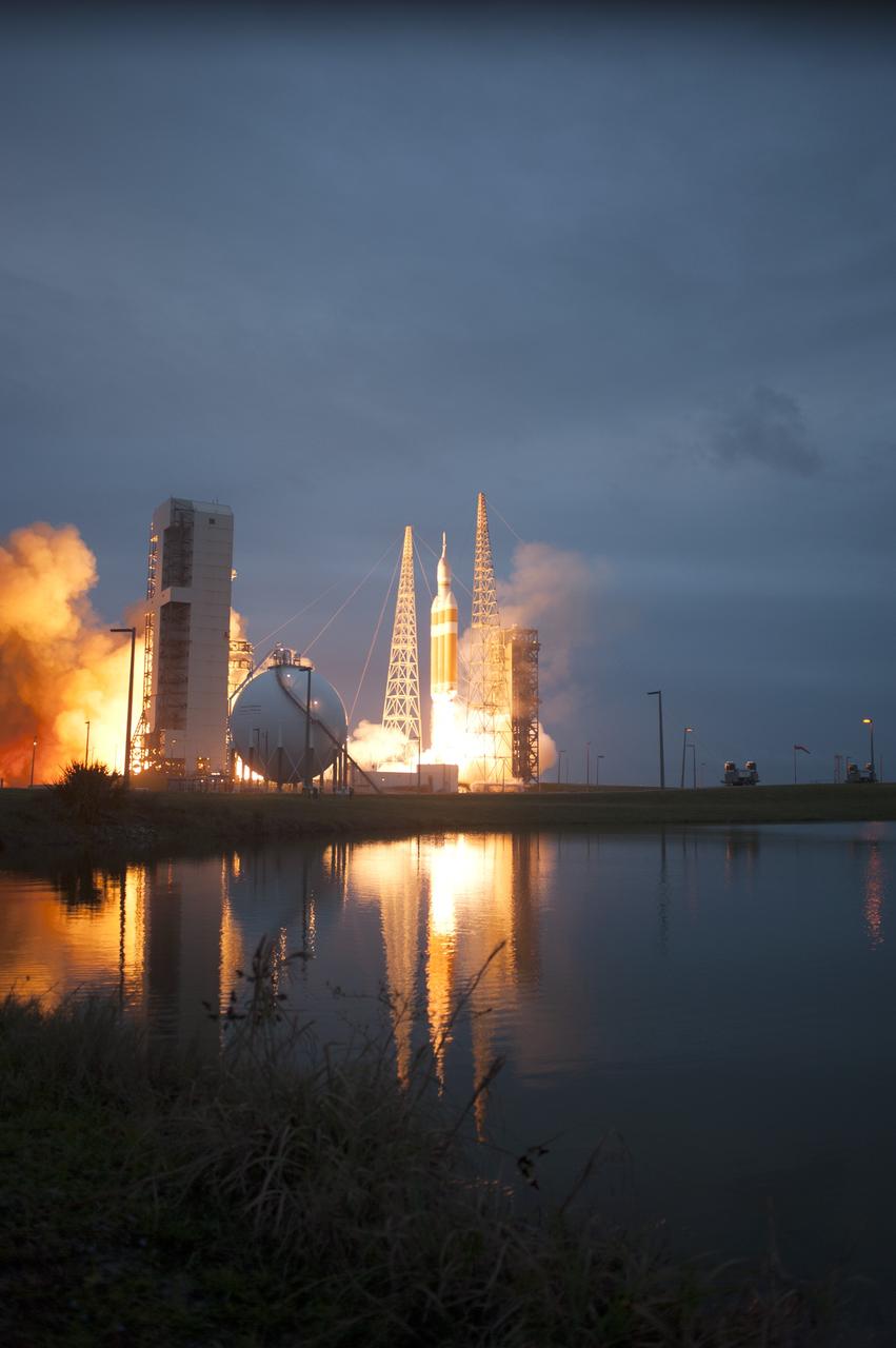 CAPE CANAVERAL, Fla. -- A Delta IV Heavy rocket lifts off from Space Launch Complex 37 at Cape Canaveral Air Force Station in Florida carrying NASA's Orion spacecraft on an unpiloted flight test to Earth orbit. Liftoff was at 7:05 a.m. EST. During the two-orbit, four-and-a-half hour mission, engineers will evaluate the systems critical to crew safety, the launch abort system, the heat shield and the parachute system. For more information, visit www.nasa.gov/orion Photo credit: NASA/ Sandy Joseph/Kevin O’Connell