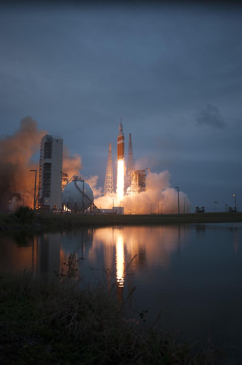 CAPE CANAVERAL, Fla. -- A Delta IV Heavy rocket lifts off from Space Launch Complex 37 at Cape Canaveral Air Force Station in Florida carrying NASA's Orion spacecraft on an unpiloted flight test to Earth orbit. Liftoff was at 7:05 a.m. EST. During the two-orbit, four-and-a-half hour mission, engineers will evaluate the systems critical to crew safety, the launch abort system, the heat shield and the parachute system. For more information, visit www.nasa.gov/orion Photo credit: NASA/ Sandy Joseph/Kevin O’Connell