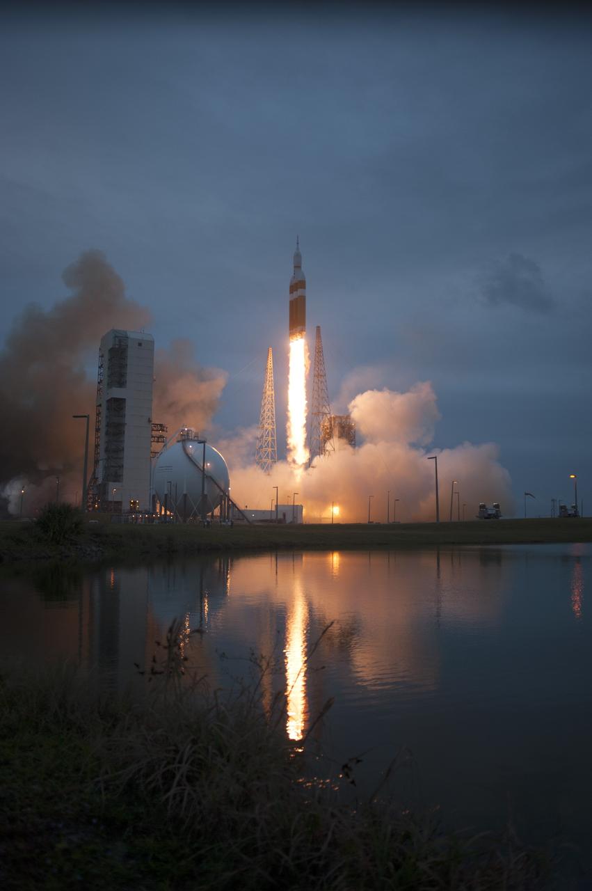 CAPE CANAVERAL, Fla. -- A Delta IV Heavy rocket lifts off from Space Launch Complex 37 at Cape Canaveral Air Force Station in Florida carrying NASA's Orion spacecraft on an unpiloted flight test to Earth orbit. Liftoff was at 7:05 a.m. EST. During the two-orbit, four-and-a-half hour mission, engineers will evaluate the systems critical to crew safety, the launch abort system, the heat shield and the parachute system. For more information, visit www.nasa.gov/orion Photo credit: NASA/ Sandy Joseph/Kevin O’Connell