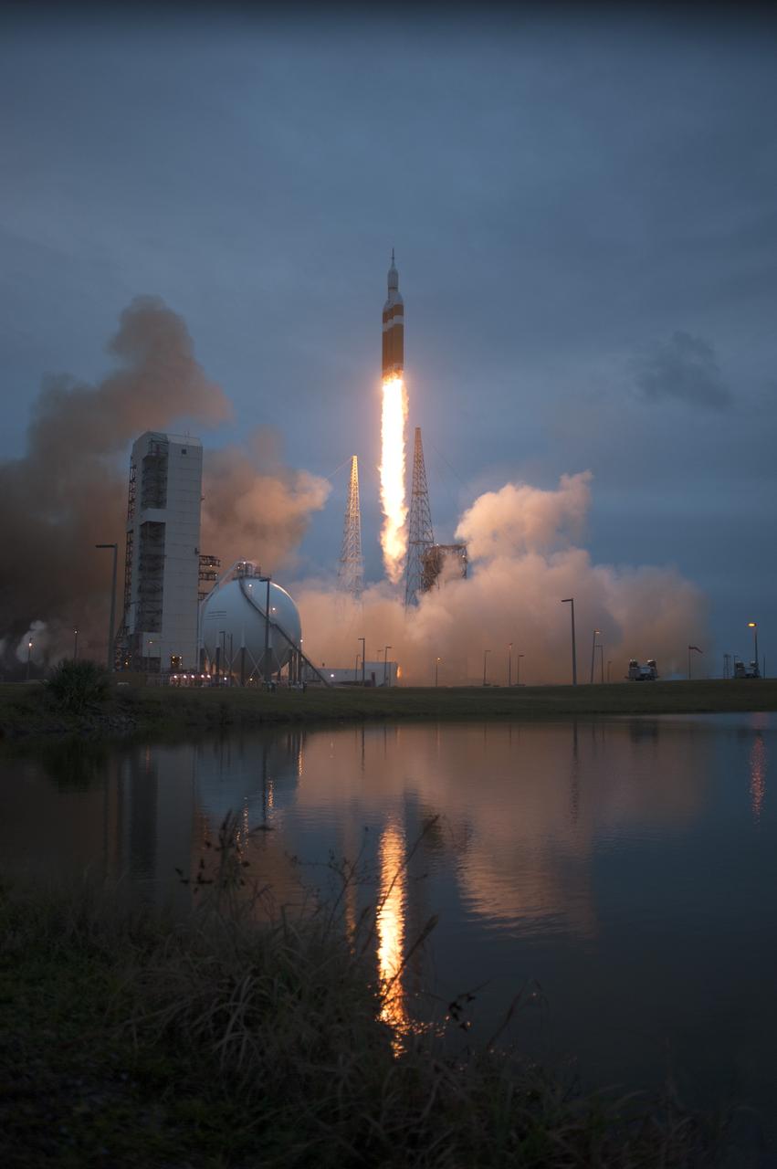CAPE CANAVERAL, Fla. -- A Delta IV Heavy rocket lifts off from Space Launch Complex 37 at Cape Canaveral Air Force Station in Florida carrying NASA's Orion spacecraft on an unpiloted flight test to Earth orbit. Liftoff was at 7:05 a.m. EST. During the two-orbit, four-and-a-half hour mission, engineers will evaluate the systems critical to crew safety, the launch abort system, the heat shield and the parachute system. For more information, visit www.nasa.gov/orion Photo credit: NASA/ Sandy Joseph/Kevin O’Connell