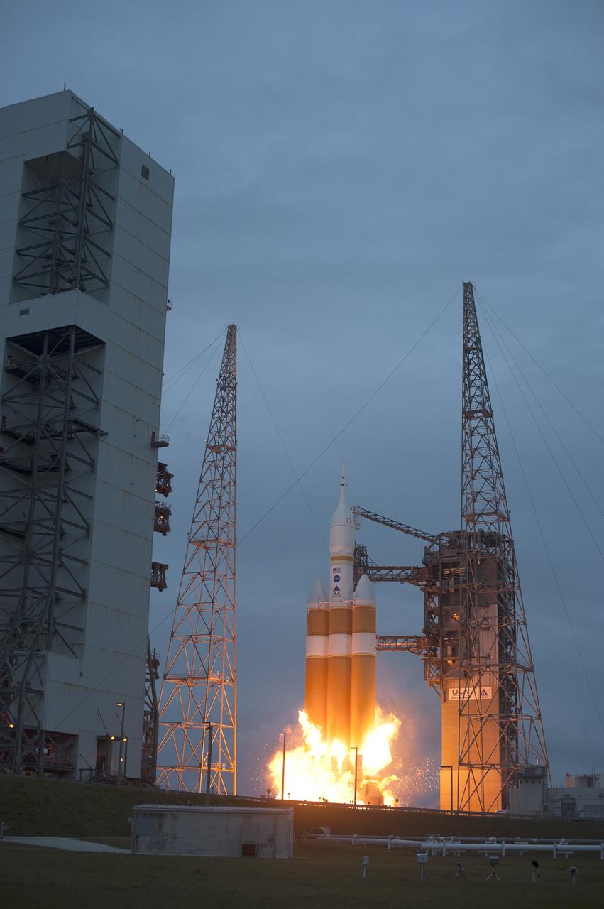 CAPE CANAVERAL, Fla. -- A Delta IV Heavy rocket lifts off from Space Launch Complex 37 at Cape Canaveral Air Force Station in Florida carrying NASA's Orion spacecraft on an unpiloted flight test to Earth orbit. Liftoff was at 7:05 a.m. EST. During the two-orbit, four-and-a-half hour mission, engineers will evaluate the systems critical to crew safety, the launch abort system, the heat shield and the parachute system. For more information, visit www.nasa.gov/orion Photo credit: NASA/Sandra Joseph, Kevin O'Connell
