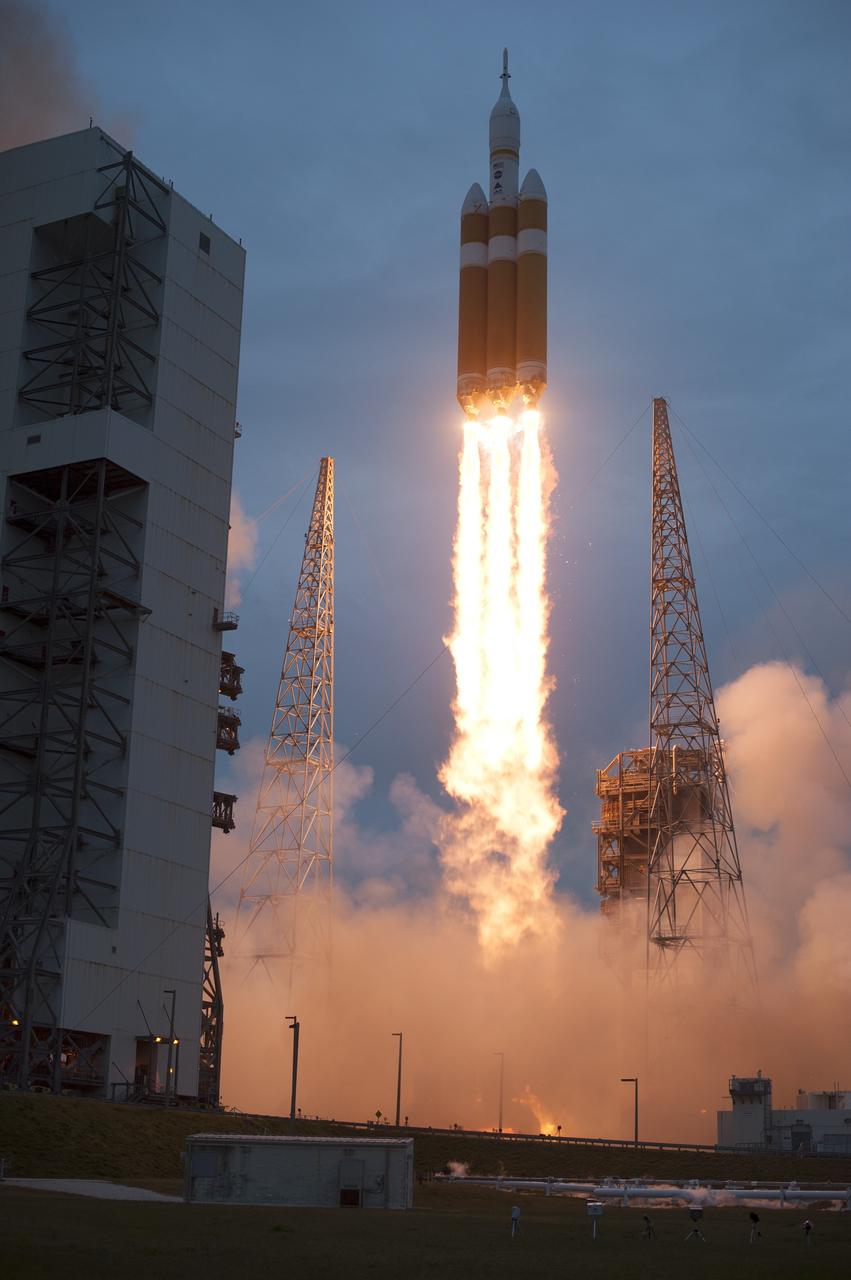 CAPE CANAVERAL, Fla. -- A Delta IV Heavy rocket lifts off from Space Launch Complex 37 at Cape Canaveral Air Force Station in Florida carrying NASA's Orion spacecraft on an unpiloted flight test to Earth orbit. Liftoff was at 7:05 a.m. EST. During the two-orbit, four-and-a-half hour mission, engineers will evaluate the systems critical to crew safety, the launch abort system, the heat shield and the parachute system. For more information, visit www.nasa.gov/orion Photo credit: NASA/Sandra Joseph and Kevin O'Connell