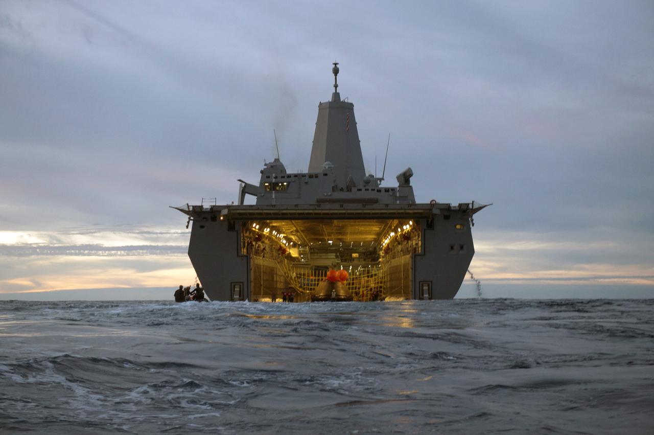SAN DIEGO, Calif. -- The Orion crew module is recovered after splashdown in the Pacific Ocean about 600 miles off the coast of San Diego, California. NASA, the U.S. Navy and Lockheed Martin coordinated efforts to recover Orion and secure the spacecraft inside the well deck of the USS Anchorage. After lifting off at 7:05 a.m. EST atop a Delta IV Heavy rocket from Space Launch Complex 37 at Cape Canaveral Air Force Station in Florida, NASA's Orion spacecraft completed a two-orbit, four-and-a-half hour mission to test systems critical to crew safety, including the launch abort system, the heat shield and the parachute system. The Ground Systems Development and Operations Program is leading the recovery efforts. For more information, visit www.nasa.gov/orion Photo credit: Courtesy of U.S. Navy