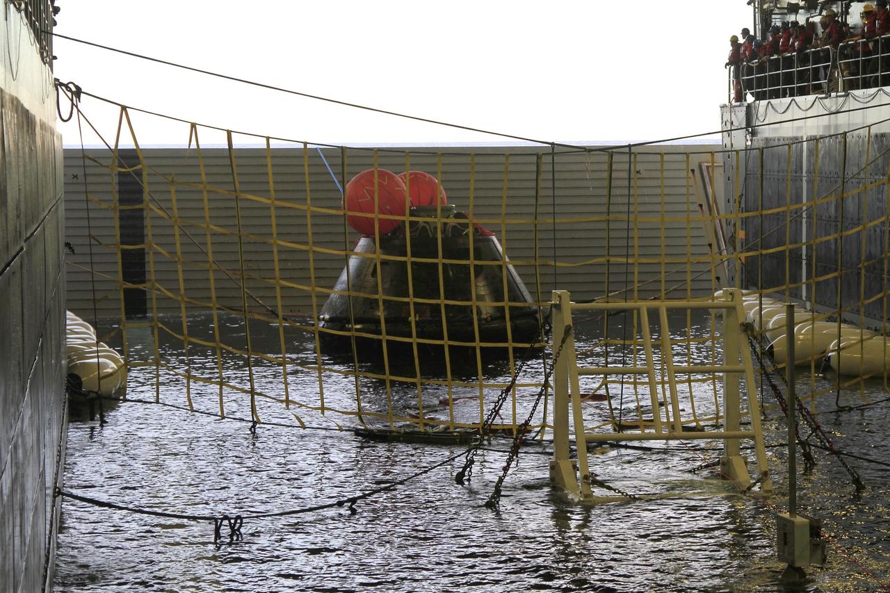 SAN DIEGO, Calif. -- NASA's Orion spacecraft has been recovered inside the flooded well deck of the USS Anchorage in the Pacific Ocean about 600 miles off the coast of San Diego, California. After lifting off at 7:05 a.m. EST atop a Delta IV Heavy rocket from Space Launch Complex 37 at Cape Canaveral Air Force Station in Florida, Orion completed a two-orbit, four-and-a-half hour mission to test systems critical to crew safety, including the launch abort system, the heat shield and the parachute system. NASA, the U.S. Navy and Lockheed Martin coordinated efforts to recover Orion after splashdown. The Ground Systems Development and Operations Program is leading the recovery efforts. For more information, visit www.nasa.gov/orion Photo credit: NASA/Cory Huston