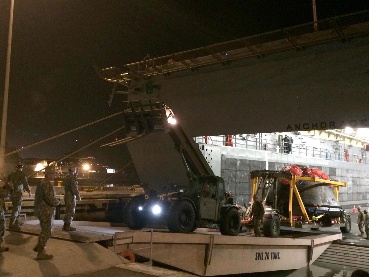 SAN DIEGO, Calif. -- At Naval Base San Diego in California, NASA's Orion spacecraft is being offloaded from the well deck of the USS Anchorage. Orion has been secured in its crew module recovery cradle and will be prepared for return to Kennedy Space Center in Florida. After lifting off at 7:05 a.m. EST on Dec. 5 atop a Delta IV Heavy rocket from Space Launch Complex 37 at Cape Canaveral Air Force Station in Florida, Orion completed a two-orbit, four-and-a-half hour mission to test systems critical to crew safety, including the launch abort system, the heat shield and the parachute system. NASA, the U.S. Navy and Lockheed Martin coordinated efforts to recover Orion after splashdown in the Pacific Ocean. The Ground Systems Development and Operations Program led the recovery efforts. For more information, visit www.nasa.gov/orion Photo credit: NASA/Amber Philman