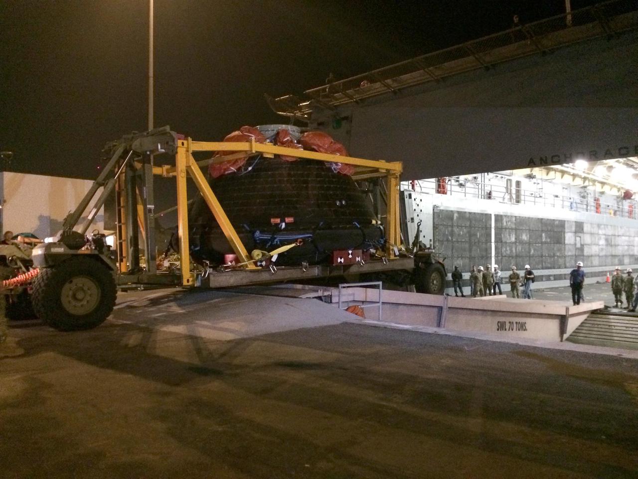 SAN DIEGO, Calif. -- At Naval Base San Diego in California, NASA's Orion spacecraft is being offloaded from the well deck of the USS Anchorage. Orion has been secured in its crew module recovery cradle and will be prepared for return to Kennedy Space Center in Florida. After lifting off at 7:05 a.m. EST on Dec. 5 atop a Delta IV Heavy rocket from Space Launch Complex 37 at Cape Canaveral Air Force Station in Florida, Orion completed a two-orbit, four-and-a-half hour mission to test systems critical to crew safety, including the launch abort system, the heat shield and the parachute system. NASA, the U.S. Navy and Lockheed Martin coordinated efforts to recover Orion after splashdown in the Pacific Ocean. The Ground Systems Development and Operations Program led the recovery efforts. For more information, visit www.nasa.gov/orion Photo credit: NASA/Amber Philman