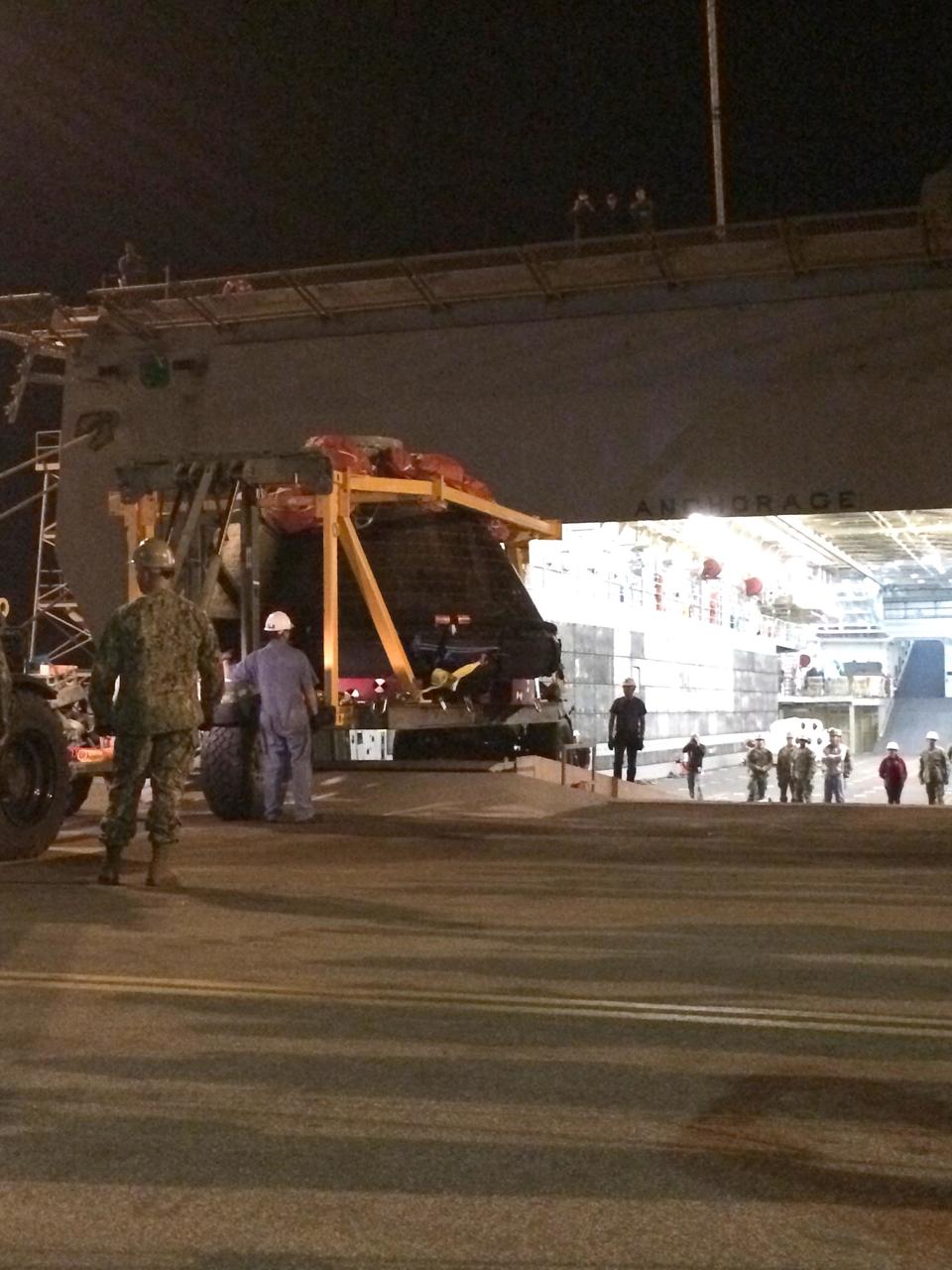 SAN DIEGO, Calif. -- At Naval Base San Diego in California, NASA's Orion spacecraft is being offloaded from the well deck of the USS Anchorage. Orion has been secured in its crew module recovery cradle and will be prepared for return to Kennedy Space Center in Florida. After lifting off at 7:05 a.m. EST on Dec. 5 atop a Delta IV Heavy rocket from Space Launch Complex 37 at Cape Canaveral Air Force Station in Florida, Orion completed a two-orbit, four-and-a-half hour mission to test systems critical to crew safety, including the launch abort system, the heat shield and the parachute system. NASA, the U.S. Navy and Lockheed Martin coordinated efforts to recover Orion after splashdown in the Pacific Ocean. The Ground Systems Development and Operations Program is led the recovery efforts. For more information, visit www.nasa.gov/orion Photo credit: NASA/Amber Philman