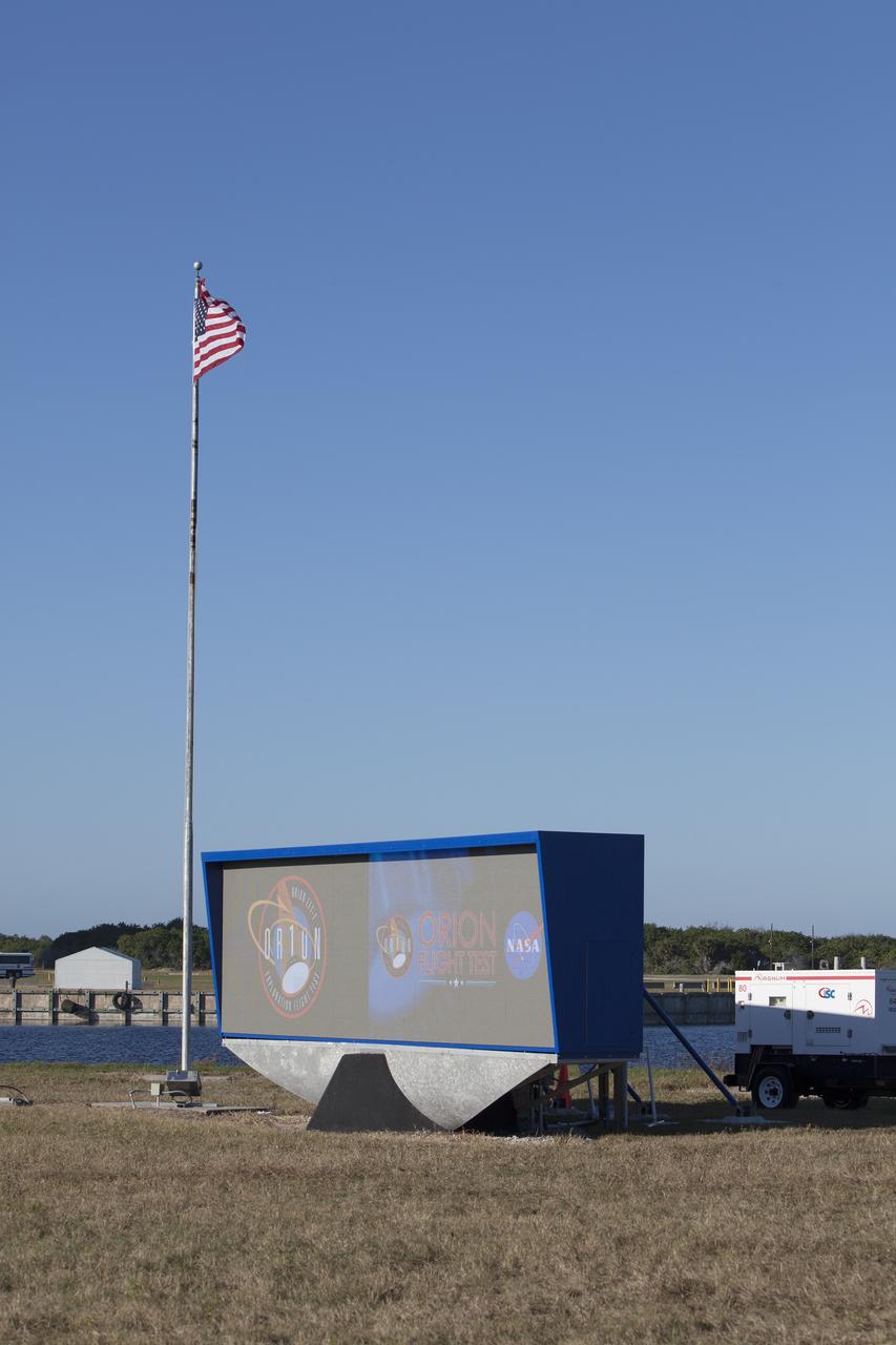 CAPE CANAVERAL, Fla. – At NASA's Kennedy Space Center in Florida, a shade is placed around the new countdown clock at the spaceport's Press Site. The modern, multimedia display is similar to the screens seen at sporting venues. The new screen is nearly 26 feet wide by 7 feet high, a foot taller than the original clock. The historic countdown clock was designed by Kennedy engineers and built by space center technicians before Apollo 12 in 1969. NASA has acquired the countdown clock from the agency’s Artifact Working Group at the agency's Headquarters for display at the Kennedy Space Center Visitor Complex. For more information on the countdown clock, go to http://go.nasa.gov/10Zku10 Photo credit: NASA/Frankie Martin