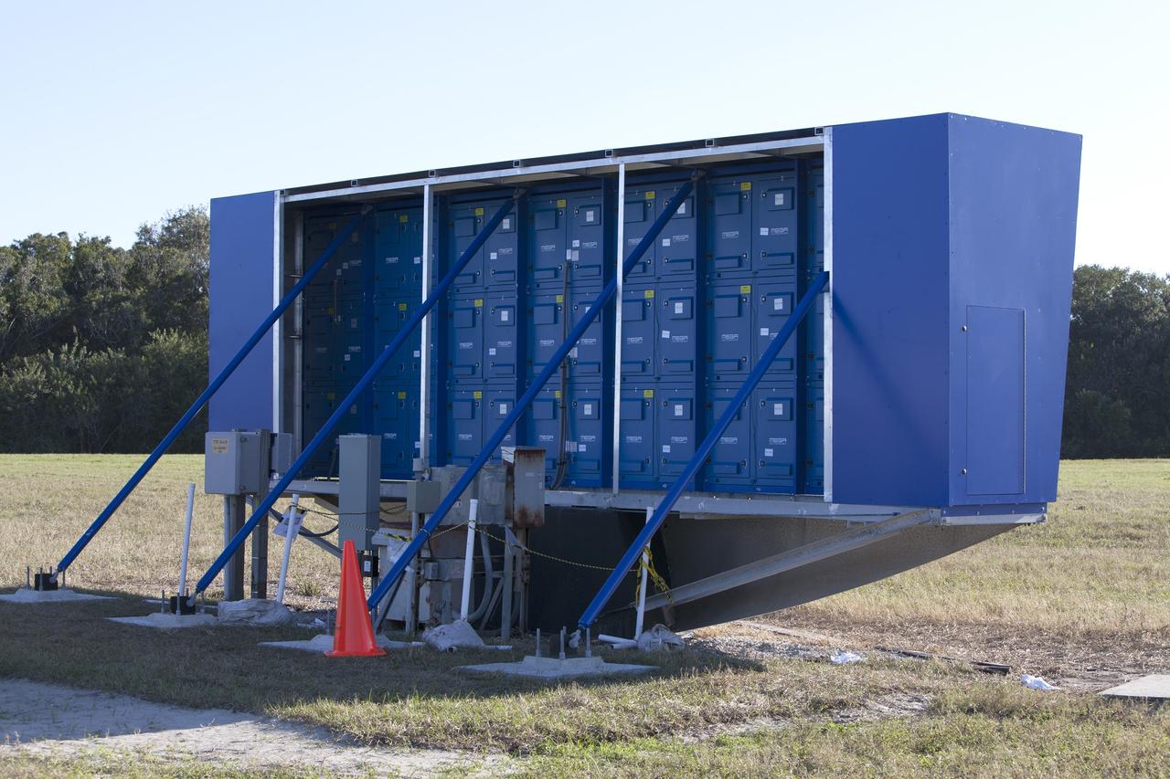 CAPE CANAVERAL, Fla. – At NASA's Kennedy Space Center in Florida, a shade is placed around the new countdown clock at the spaceport's Press Site. The modern, multimedia display is similar to the screens seen at sporting venues. The new screen is nearly 26 feet wide by 7 feet high, a foot taller than the original clock. The historic countdown clock was designed by Kennedy engineers and built by space center technicians before Apollo 12 in 1969. NASA has acquired the countdown clock from the agency’s Artifact Working Group at the agency's Headquarters for display at the Kennedy Space Center Visitor Complex. For more information on the countdown clock, go to http://go.nasa.gov/10Zku10 Photo credit: NASA/Frankie Martin
