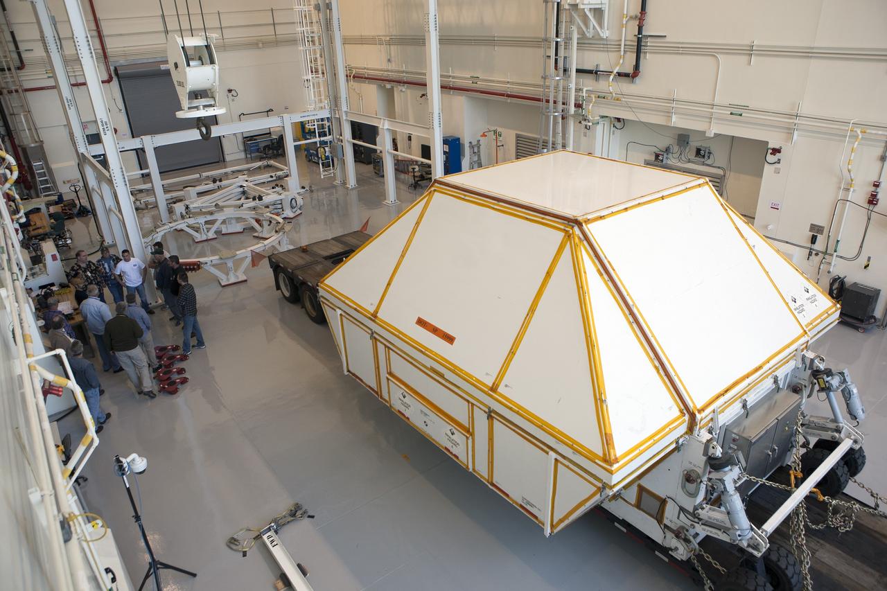 CAPE CANAVERAL, Fla. -- NASA's Orion spacecraft arrives inside the Launch Abort System Facility at Kennedy Space Center in Florida. The spacecraft was transported 2,700 miles overland from Naval Base San Diego in California, on a flatbed truck secured in its crew module transportation fixture for the trip. During its first flight test, Orion completed a two-orbit, four-and-a-half hour mission Dec. 5 to test systems critical to crew safety, including the launch abort system, the heat shield and the parachute system. The Ground Systems Development and Operations Program led the recovery, offload and transportation efforts. For more information, visit www.nasa.gov/orion. Photo credit: NASA/Kim Shiflett