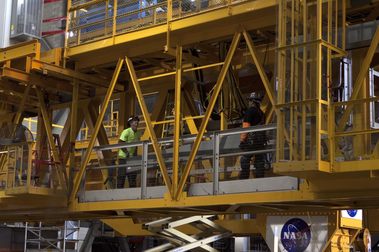 CAPE CANAVERAL, Fla. – Inside the Vehicle Assembly Building at NASA's Kennedy Space Center in Florida, construction workers continue with refurbishment and upgrades to the 175-ton crane on the ground floor of the transfer aisle. The crane's 45-year-old controls are being upgraded to improve reliability, precision and safety. The Ground Systems Development and Operations Program is overseeing upgrades and modifications to the crane so that it can support lifting needs for NASA and other exploration vehicles, including the agency's Space Launch System and Orion spacecraft. Photo credit: NASA/Kim Shiflett