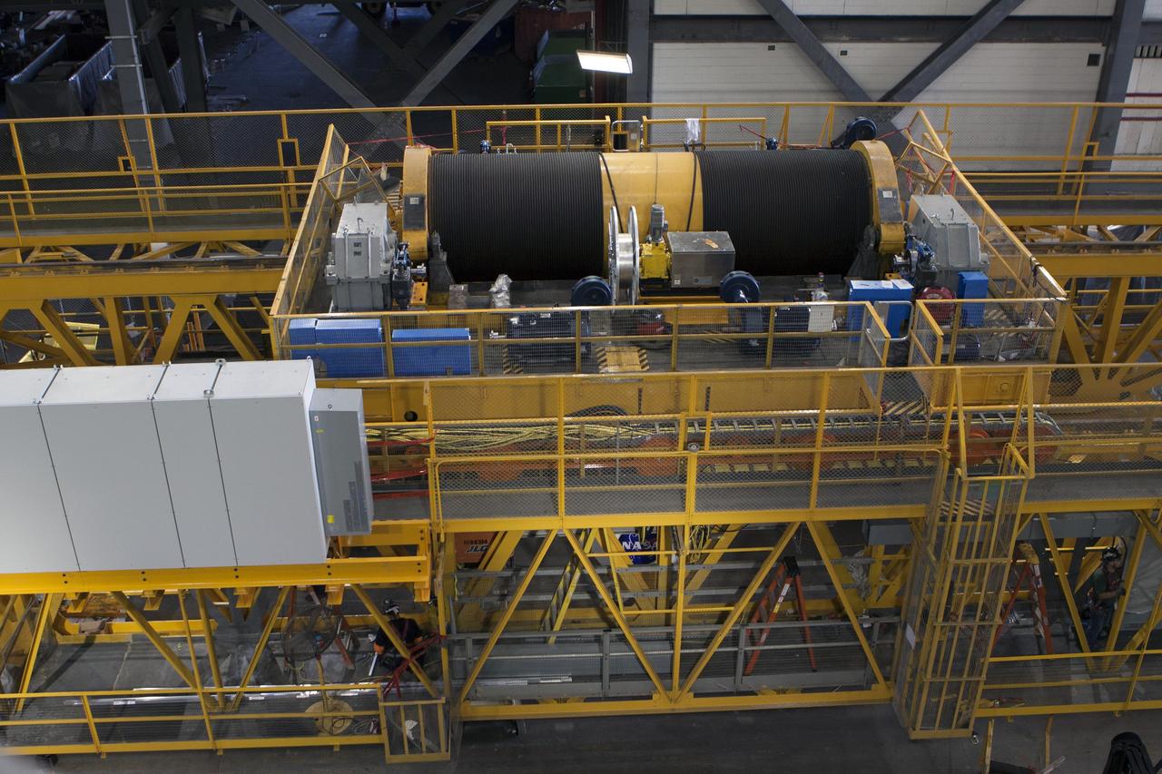CAPE CANAVERAL, Fla. – A view from above inside the Vehicle Assembly Building at NASA's Kennedy Space Center in Florida, shows the 175-ton crane on the ground floor of the transfer aisle. The crane's 45-year-old controls are being upgraded to improve reliability, precision and safety. The Ground Systems Development and Operations Program is overseeing upgrades and modifications to the crane so that it can support lifting needs for NASA and other exploration vehicles, including the agency's Space Launch System and Orion spacecraft. Photo credit: NASA/Kim Shiflett