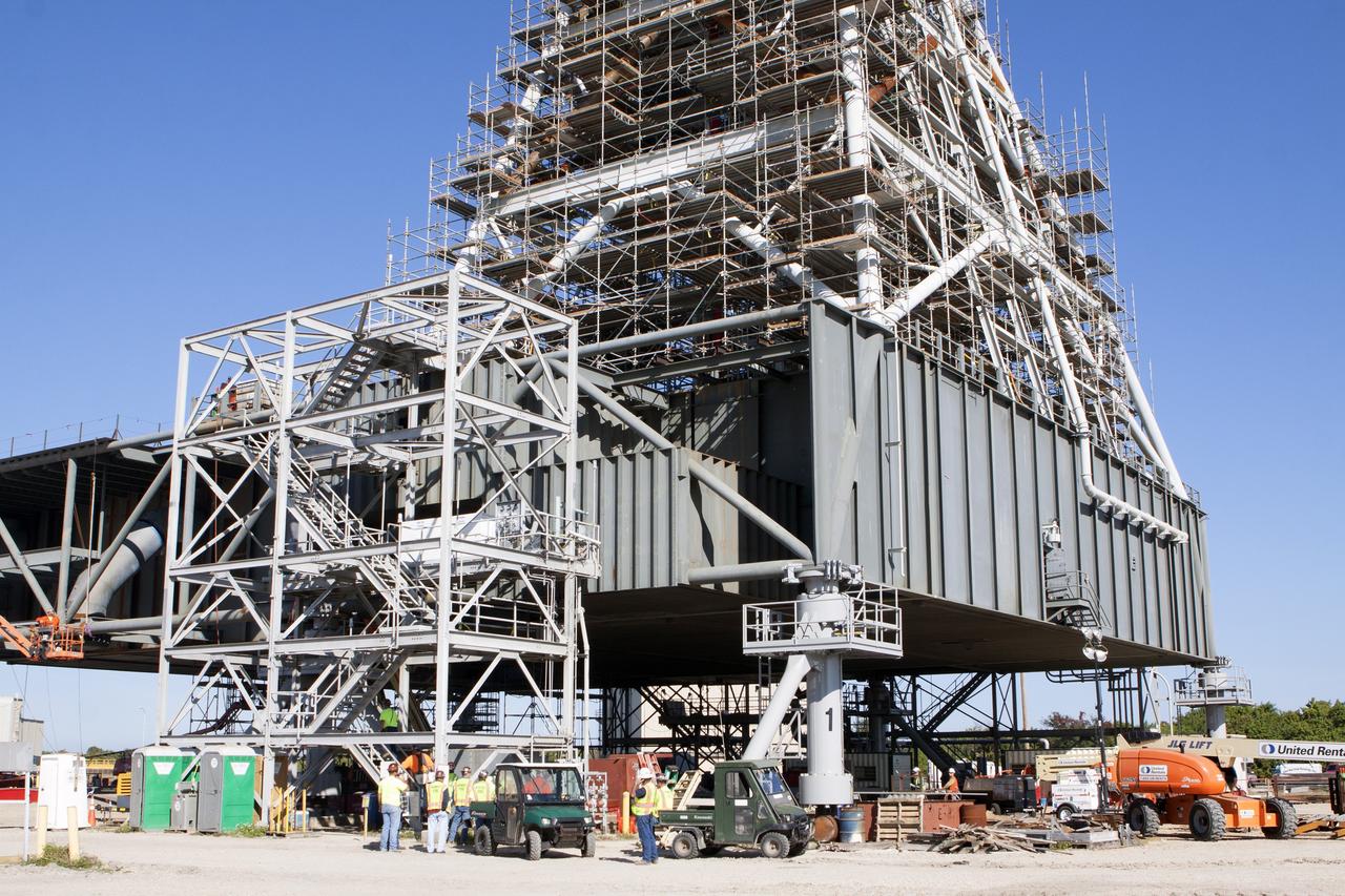 CAPE CANAVERAL, Fla. – Modifications continue on the Mobile Launcher, or ML, at the Mobile Launcher Park Site at NASA’s Kennedy Space Center in Florida. Scaffolding, or work platforms, have been installed around the base of the tower on the ML to continue upgrades and modifications to the structure. The ML is being modified and strengthened to accommodate the weight, size and thrust at launch of NASA's Space Launch System, or SLS, and Orion spacecraft. The ML is one of the key elements of ground support equipment that is being upgraded by the Ground Systems Development and Operations Program at Kennedy. The ML will carry the SLS rocket and Orion spacecraft to Launch Pad 39B for its first uncrewed mission, Exploration Mission-1, in 2018. Photo credit: NASA/Kim Shiflett