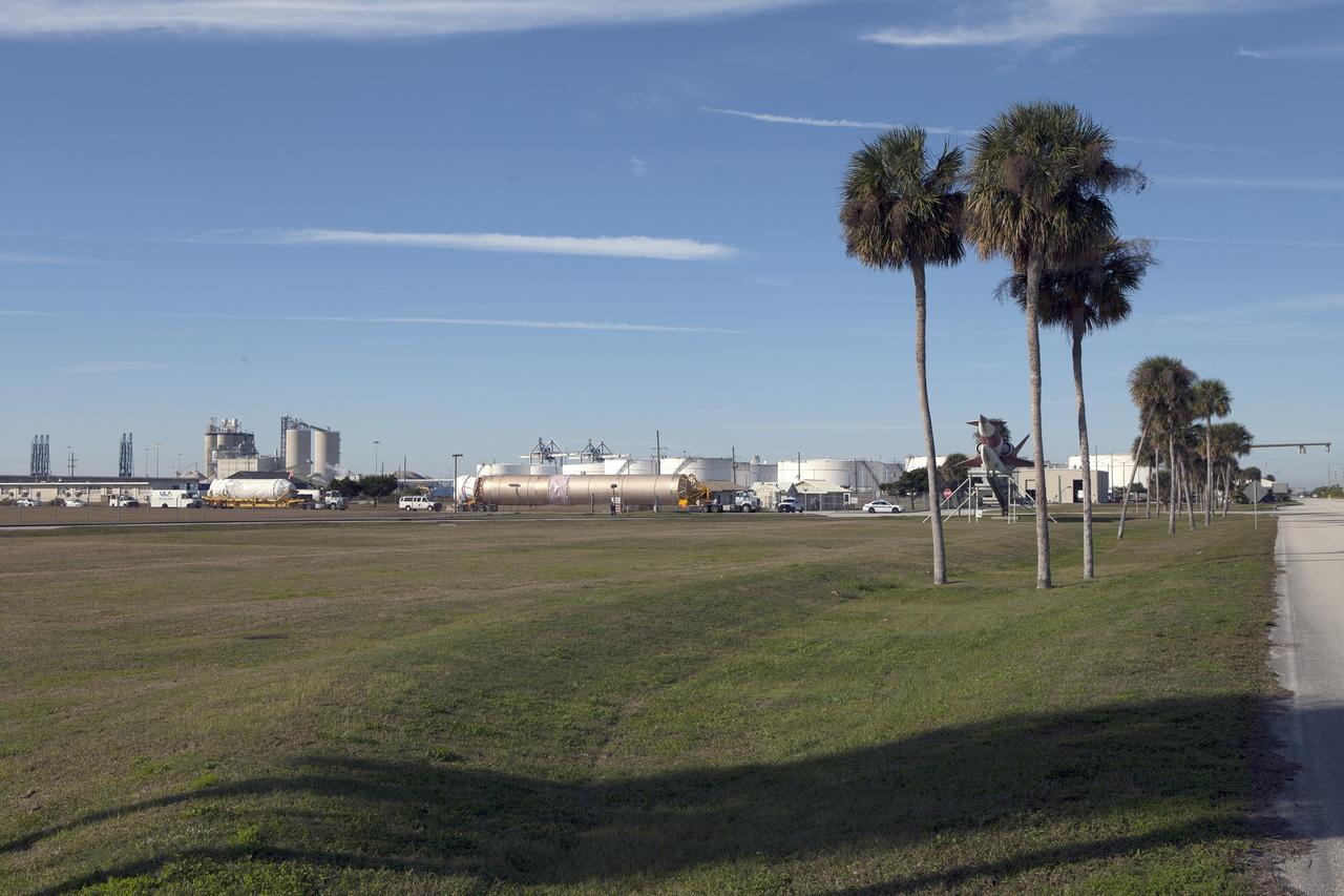 CAPE CANAVERAL, Fla. – Trucks transport the Atlas V rocket and Centaur upper stage from the United Launch Alliance Delta Mariner to the Atlas V Spaceflight Operations Center at Cape Canaveral Air Force Station. The rocket will be used to launch NASA's Magnetospheric Multiscale mission. To learn about the MMS, go to http://go.nasa.gov/1GUbzxb. Photo credit: NASA/Ben Smegelsky
