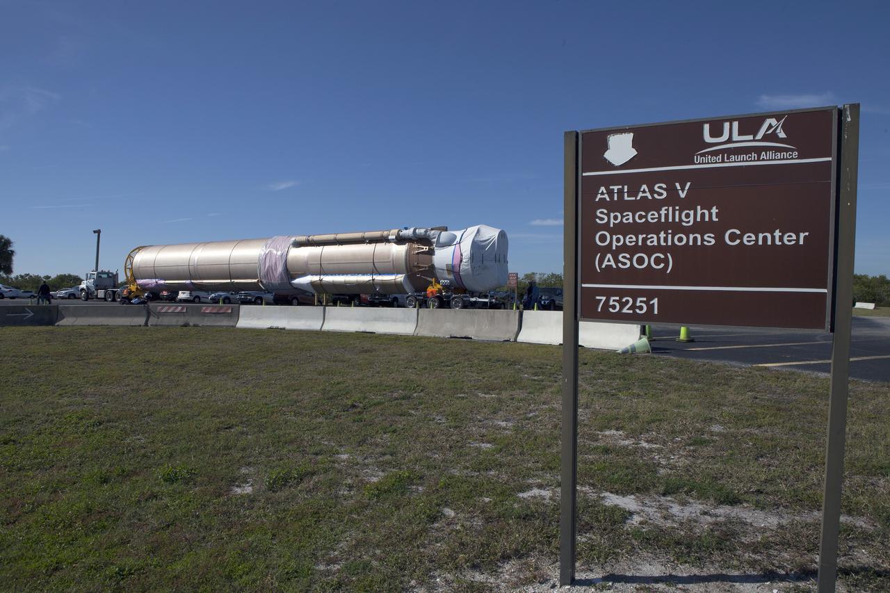 CAPE CANAVERAL, Fla. – Trucks transport the Atlas V rocket and Centaur upper stage from the United Launch Alliance Delta Mariner to the Atlas V Spaceflight Operations Center at Cape Canaveral Air Force Station. The rocket will be used to launch NASA's Magnetospheric Multiscale mission. To learn about the MMS, go to http://go.nasa.gov/1GUbzxb. Photo credit: NASA/Ben Smegelsky