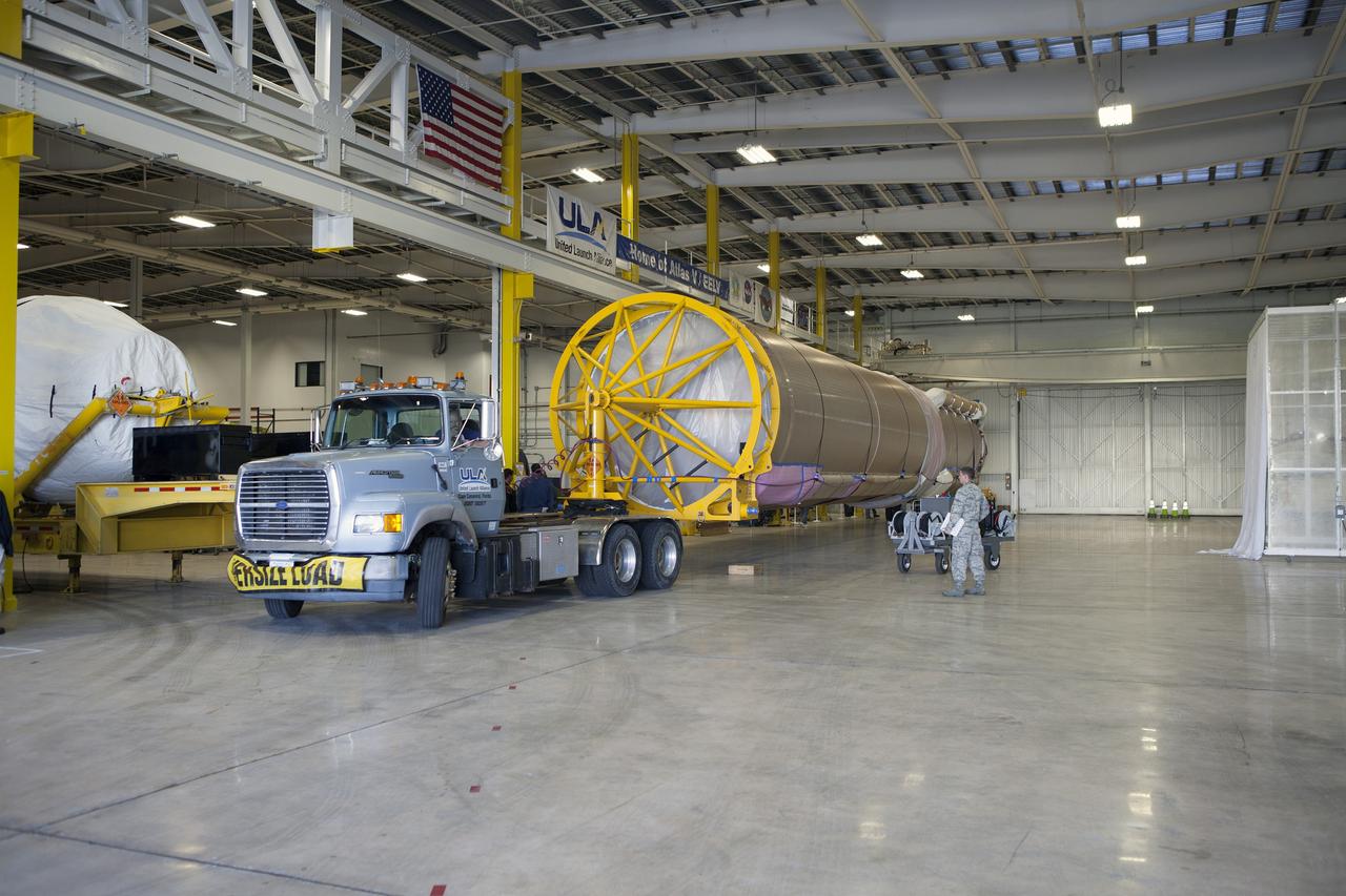 CAPE CANAVERAL, Fla. – A truck positions an Atlas V booster stage inside the hangar at the Atlas V Spaceflight Operations Center at Cape Canaveral Air Force Station. The rocket will be used to launch NASA's Magnetospheric Multiscale mission. To learn about the MMS, go to http://go.nasa.gov/1GUbzxb. Photo credit: NASA/Ben Smegelsky