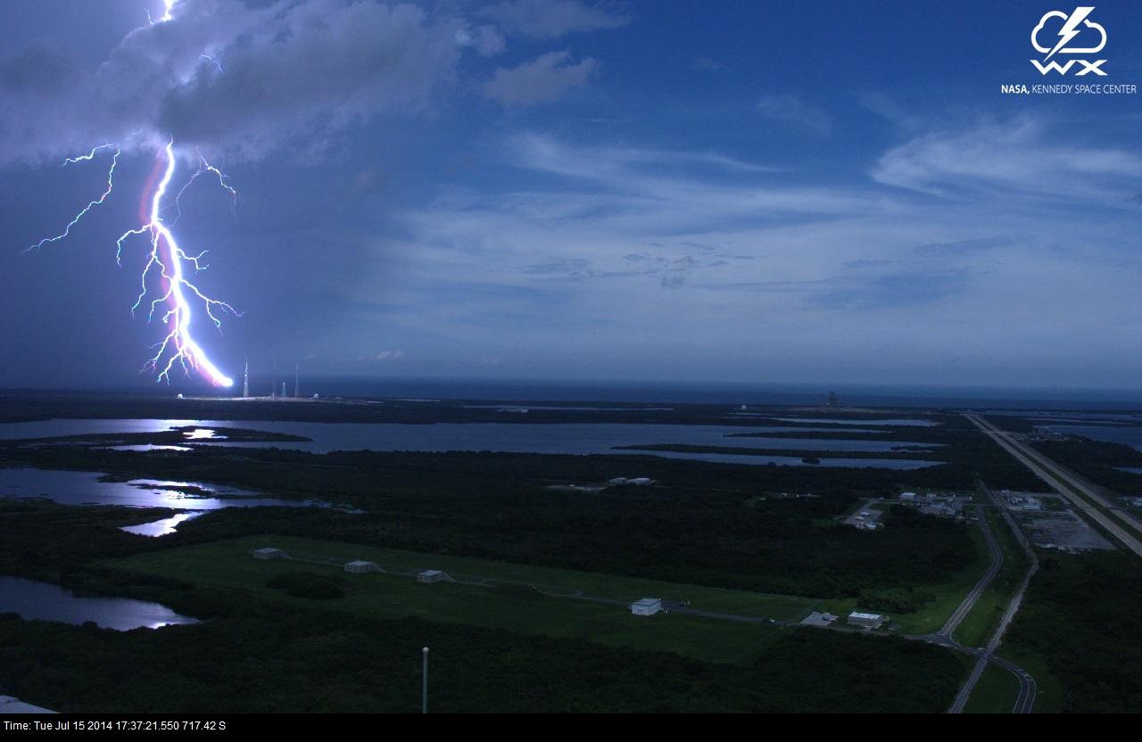 A lightning strike is recorded at Launch Complex 39B at NASA’s Kennedy Space Center in Florida in July 2014. The event was captured by high-speed camera from the iconic Vehicle Assembly Building. At pad 39B, there are three, 600-foot-tall masts with overhead wires used to transmit electrical energy around the perimeter of the pad to provide lightning protection for launch vehicles as they are processed and launched from the pad.