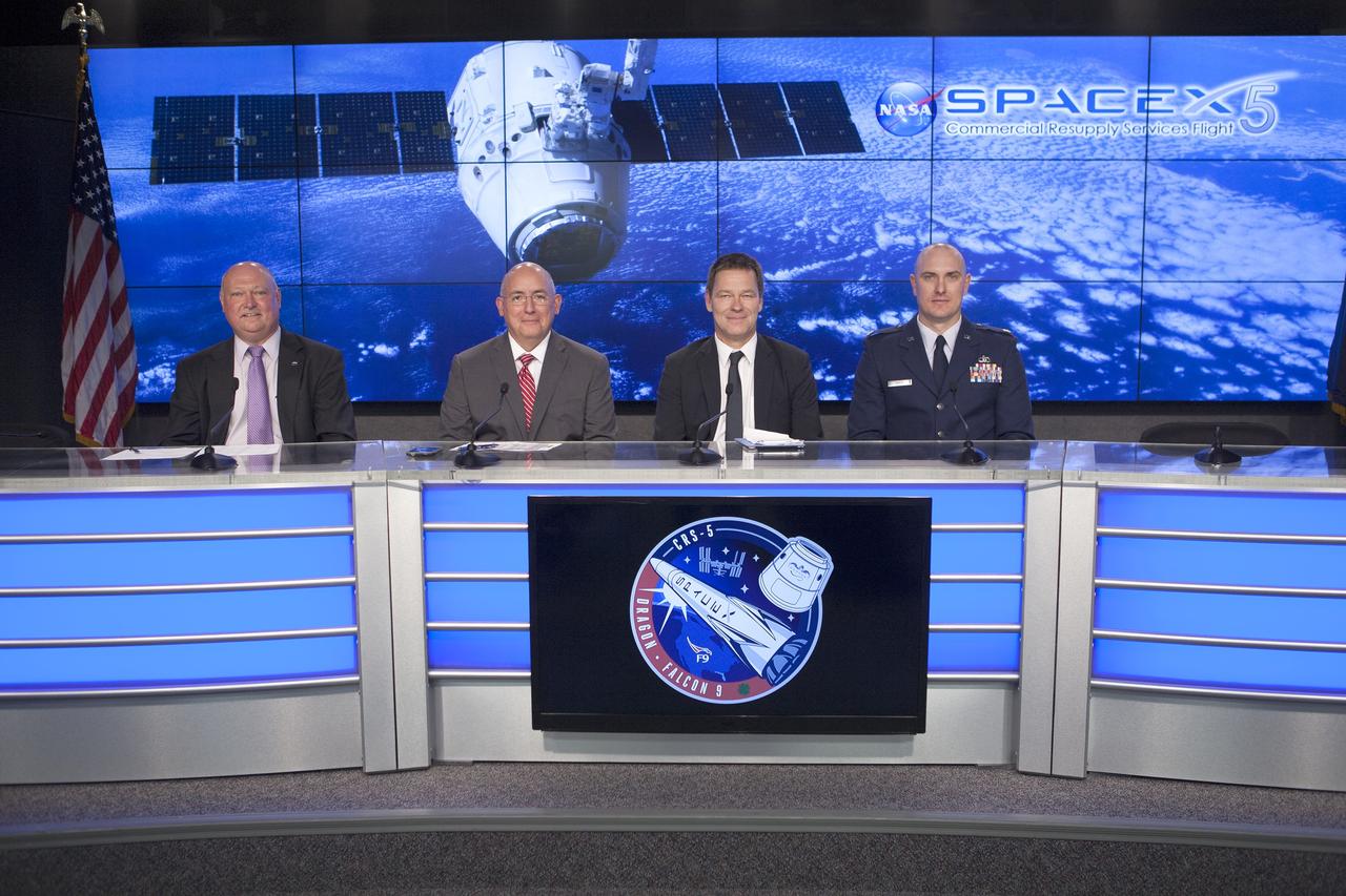 In the Kennedy Space Center’s Press Site auditorium, agency and industry leaders spoke to members of the news media as the SpaceX Dragon spacecraft and its Falcon 9 rocket were being prepared for launch. From left are: Mike Curie of NASA Public Affairs, Mike Suffredini, NASA International Space Station program manager, Hans Koenigsmann, SpaceX vice president of Mission Assurance, and Maj. Perry Sweat, U.S. Air Force’s 45th Weather Squadron at Cape Canaveral Air Force Station. Photo credit: NASA/Kim Shiflett