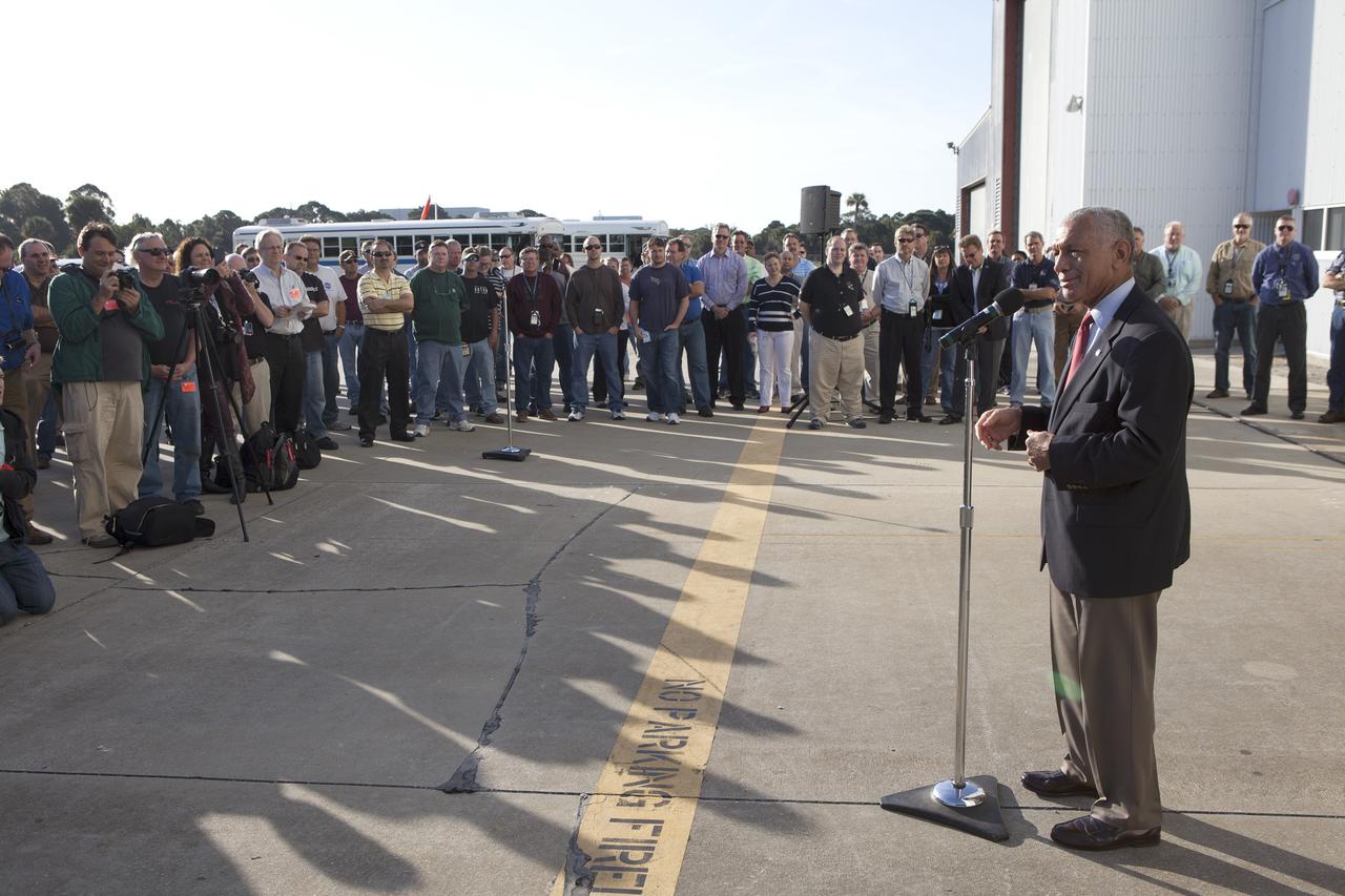 CAPE CANAVERAL, Fla. -- NASA Administrator Charlie Bolden spoke to members of the news media before looking over the agency's Orion spacecraft this morning for the first time since it returned to Kennedy Space Center following the successful Orion flight test on Dec. 5. Bearing the marks of a spacecraft that has returned to Earth through a searing plunge into the atmosphere, Orion is perched on a pedestal inside the Launch Abort System Facility at Kennedy where it is going through post-mission processing. Although the spacecraft Bolden looked over did not fly with a crew aboard during the flight test, Orion is designed to carry astronauts into deep space in the future setting NASA and the nation firmly on the journey to Mars. Photo credit: NASA/Cory Huston
