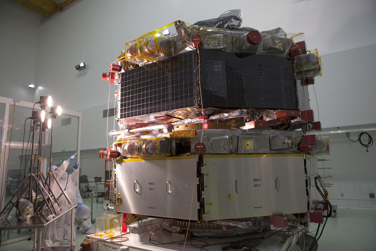 A solar array illumination test is performed on the upper stack of the Magnetospheric Multiscale spacecraft, or MMS, in the Astrotech payload processing facility in Titusville, Florida, near Kennedy Space Center. Illumination testing of the lower instrumentation payload stack was completed in December. Launch aboard a United Launch Alliance Atlas V rocket from Space Launch Complex 41 on Cape Canaveral Air Force Station is targeted for March 12. To learn more about MMS, visit http://www.nasa.gov/mms.  Photo credit: NASA/Kim Shiflett