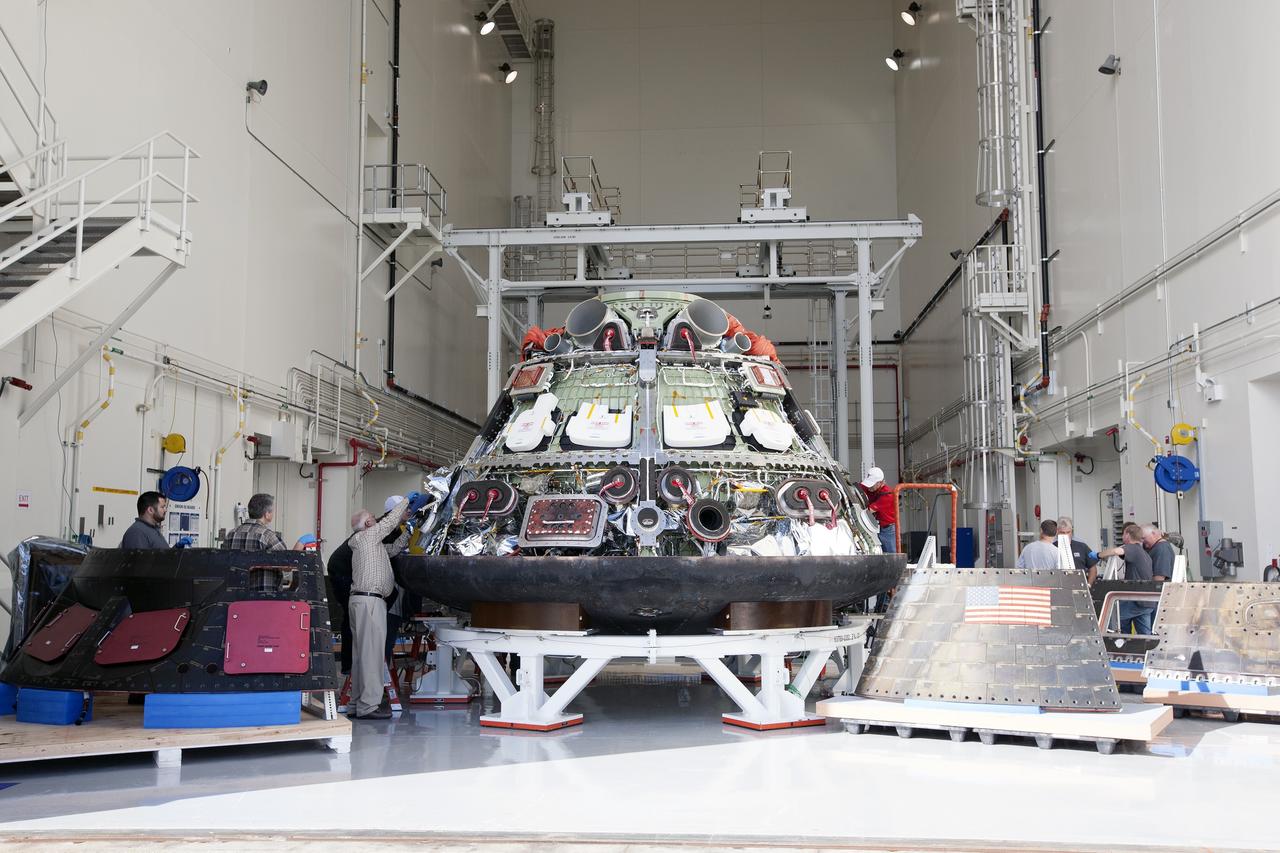 CAPE CANAVERAL, Fla. -- NASA's Orion spacecraft is positioned inside the Launch Abort System Facility at NASA's Kennedy Space Center in Florida in preparation for a viewing by Kennedy workers. Orion's back shell panels have been removed. The spacecraft completed the first flight test in December, was retrieved from the Pacific Ocean, and transported 2,700 miles overland to Kennedy from Naval Base San Diego in California. Analysis of data obtained during its two-orbit, four-and-a-half hour mission Dec. 5 will provide engineers detailed information on how the spacecraft fared. Orion will be transported to the Payload Hazardous Servicing Facility for deservicing. For more information, visit www.nasa.gov/orion. Photo credit: NASA/Kim Shiflett