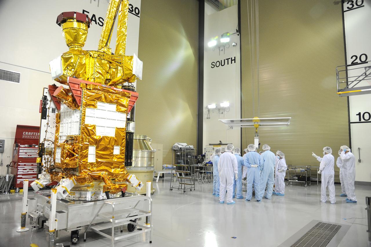VANDENBERG AIR FORCE BASE, Calif. – Preparations are underway to attach NASA's Soil Moisture Active Passive, or SMAP, spacecraft to the Delta II payload attach structure in the Astrotech payload processing facility on Vandenberg Air Force Base in California. The structure will secure the spacecraft to the rocket's second stage.    SMAP will launch on a Delta II 7320 configuration vehicle featuring a United Launch Alliance first stage booster powered by an Aerojet Rocketdyne RS-27A main engine and three Alliant Techsystems, or ATK, strap-on solid rocket motors. Once on station in Earth orbit, SMAP will provide global measurements of soil moisture and its freeze/thaw state. These measurements will be used to enhance understanding of processes that link the water, energy and carbon cycles, and to extend the capabilities of weather and climate prediction models. SMAP data also will be used to quantify net carbon flux in boreal landscapes and to develop improved flood prediction and drought monitoring capabilities. Launch from Space Launch Complex 2 is targeted for Jan. 29, 2015. To learn more about SMAP, visit http://www.nasa.gov/smap.  Photo credit: NASA/Chris Wiant, U.S. Air Force Photo Squadron