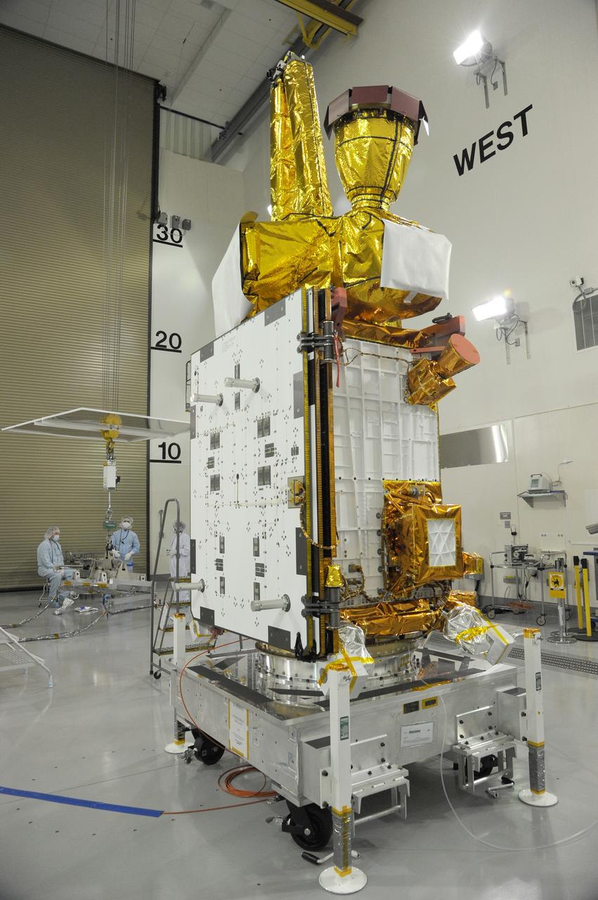 VANDENBERG AIR FORCE BASE, Calif. – Preparations are underway to attach NASA's Soil Moisture Active Passive, or SMAP, spacecraft to the Delta II payload attach structure in the Astrotech payload processing facility on Vandenberg Air Force Base in California. The structure will secure the spacecraft to the rocket's second stage.    SMAP will launch on a Delta II 7320 configuration vehicle featuring a United Launch Alliance first stage booster powered by an Aerojet Rocketdyne RS-27A main engine and three Alliant Techsystems, or ATK, strap-on solid rocket motors. Once on station in Earth orbit, SMAP will provide global measurements of soil moisture and its freeze/thaw state. These measurements will be used to enhance understanding of processes that link the water, energy and carbon cycles, and to extend the capabilities of weather and climate prediction models. SMAP data also will be used to quantify net carbon flux in boreal landscapes and to develop improved flood prediction and drought monitoring capabilities. Launch from Space Launch Complex 2 is targeted for Jan. 29, 2015. To learn more about SMAP, visit http://www.nasa.gov/smap.  Photo credit: NASA/Chris Wiant, U.S. Air Force Photo Squadron