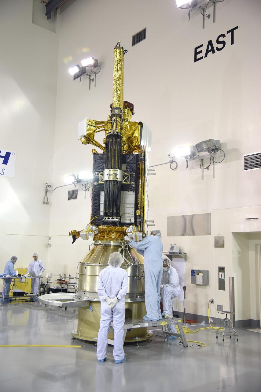 VANDENBERG AIR FORCE BASE, Calif. – Inside the Astrotech payload processing facility at Vandenberg Air Force Base in California, engineers and technicians inspect NASA's Soil Moisture Active Passive mission, or SMAP, satellite. SMAP will provide global measurements of soil moisture and its freeze/thaw state. These measurements will be used to enhance understanding of processes that link the water, energy and carbon cycles, and to extend the capabilities of weather and climate prediction models. SMAP data also will be used to quantify net carbon flux in boreal landscapes and to develop improved flood prediction and drought monitoring capabilities. Launch is scheduled for Jan. 29, 2015. To learn more about SMAP, visit http://smap.jpl.nasa.gov Photo credit: Jeremy Moore, USAF Photo Squadron