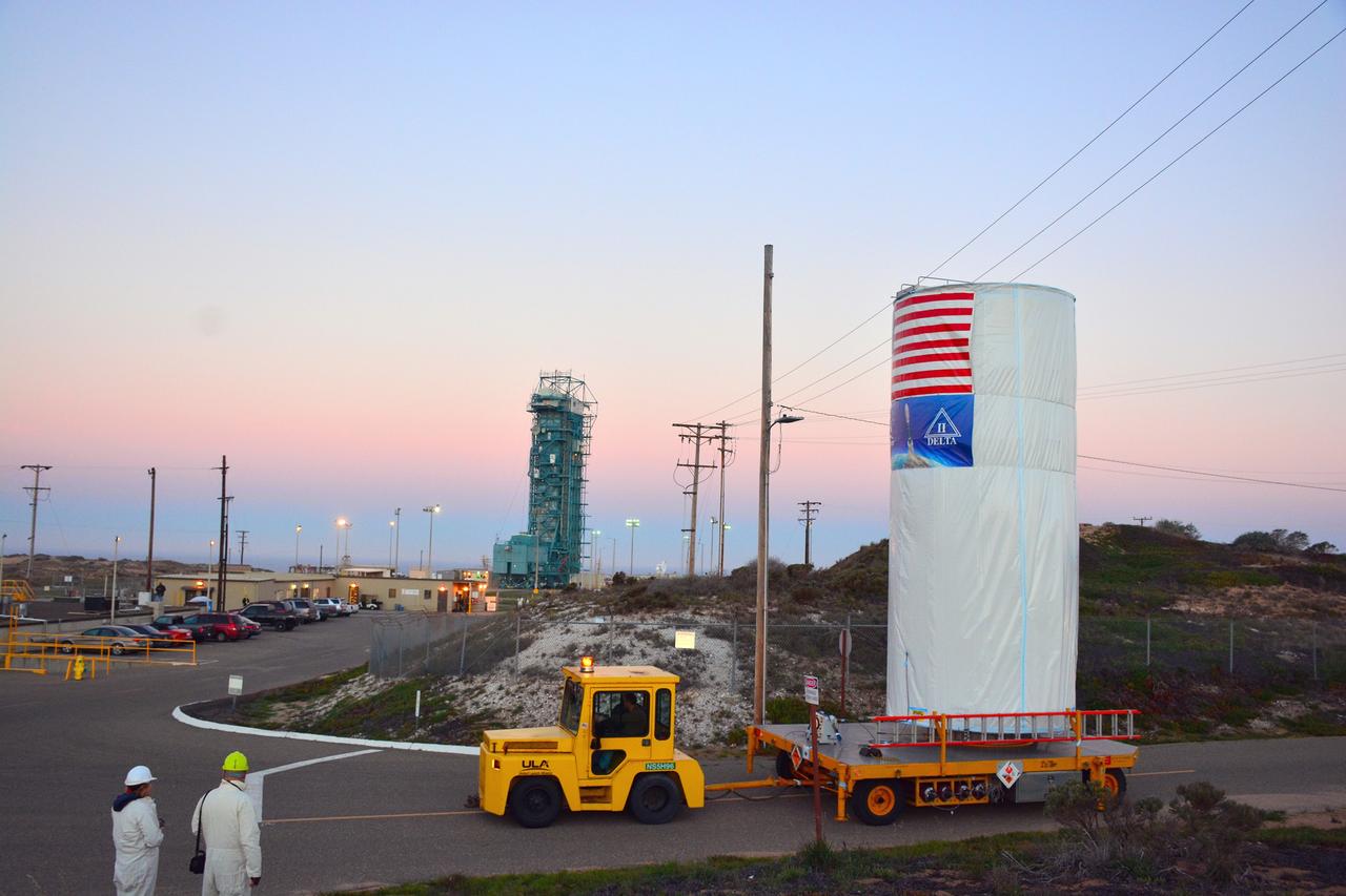 VANDENBERG AIR FORCE BASE, Calif. – At Vandenberg Air Force Base in California, NASA's Soil Moisture Active Passive mission, or SMAP, satellite is transported to Space Launch Complex 2 where it will be mated to a Delta II rocket.    SMAP will provide global measurements of soil moisture and its freeze/thaw state. These measurements will be used to enhance understanding of processes that link the water, energy and carbon cycles, and to extend the capabilities of weather and climate prediction models. SMAP data also will be used to quantify net carbon flux in boreal landscapes and to develop improved flood prediction and drought monitoring capabilities. Launch is scheduled for Jan. 29, 2015. To learn more about SMAP, visit http://smap.jpl.nasa.gov Photo credit: NASA/Randy Beaudoin