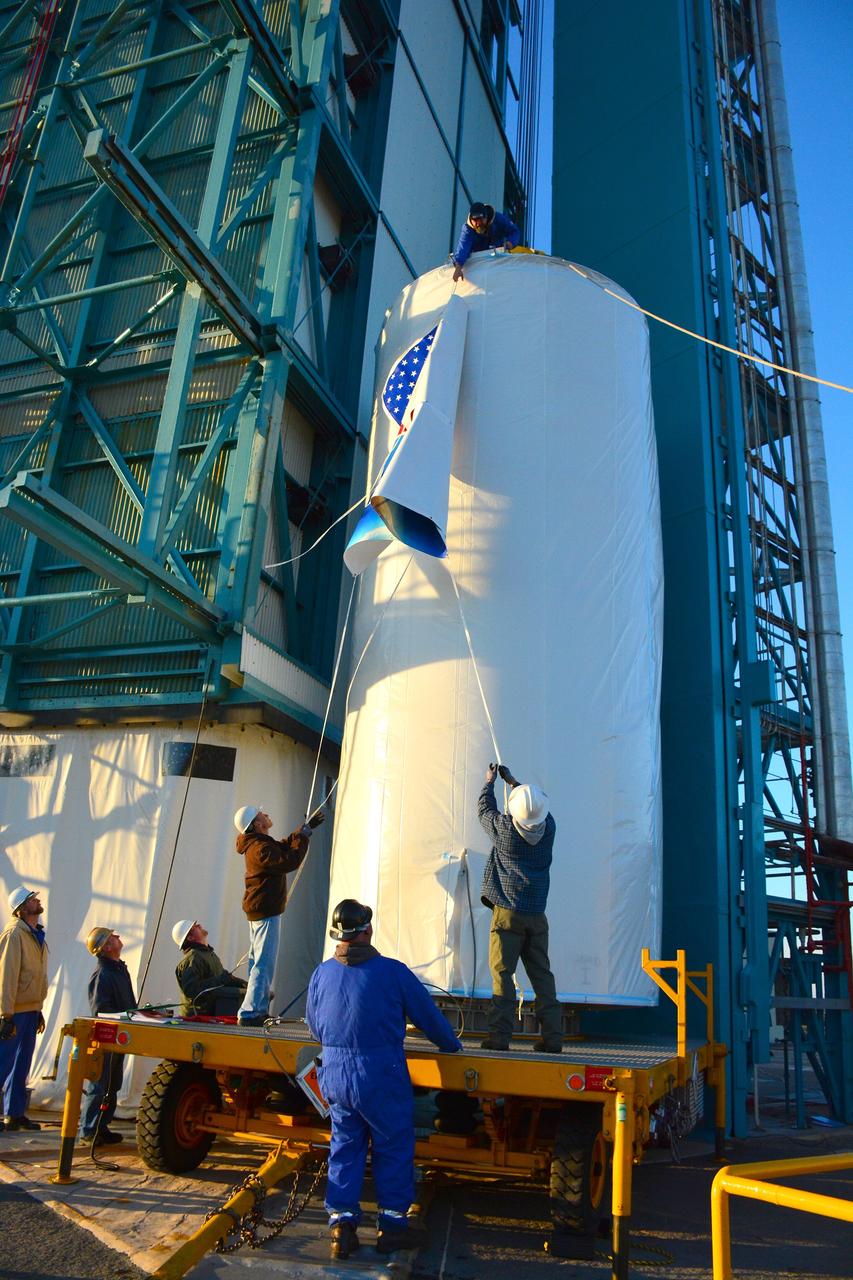 VANDENBERG AIR FORCE BASE, Calif. – At Vandenberg Air Force Base in California, NASA's Soil Moisture Active Passive mission, or SMAP, satellite is prepared for lifting at Space Launch Complex 2 for mating to its Delta II rocket.    SMAP will provide global measurements of soil moisture and its freeze/thaw state. These measurements will be used to enhance understanding of processes that link the water, energy and carbon cycles, and to extend the capabilities of weather and climate prediction models. SMAP data also will be used to quantify net carbon flux in boreal landscapes and to develop improved flood prediction and drought monitoring capabilities. Launch is scheduled for Jan. 29, 2015. To learn more about SMAP, visit http://smap.jpl.nasa.gov Photo credit: NASA/Randy Beaudoin