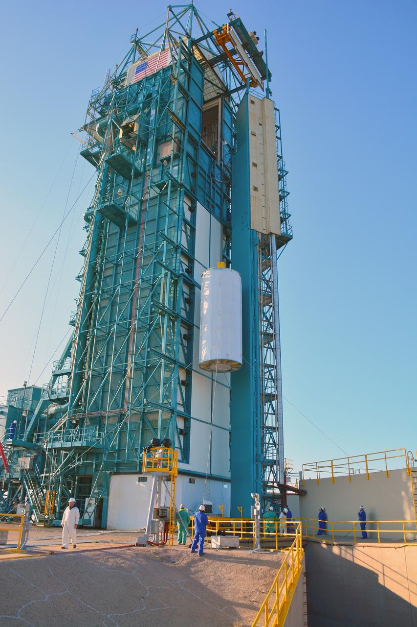 VANDENBERG AIR FORCE BASE, Calif. – At Vandenberg Air Force Base in California, NASA's Soil Moisture Active Passive mission, or SMAP, satellite is lifted at Space Launch Complex 2 for mating to its Delta II rocket.    SMAP will provide global measurements of soil moisture and its freeze/thaw state. These measurements will be used to enhance understanding of processes that link the water, energy and carbon cycles, and to extend the capabilities of weather and climate prediction models. SMAP data also will be used to quantify net carbon flux in boreal landscapes and to develop improved flood prediction and drought monitoring capabilities. Launch is scheduled for Jan. 29, 2015. To learn more about SMAP, visit http://smap.jpl.nasa.gov Photo credit: NASA/Randy Beaudoin