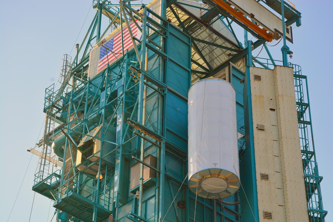 VANDENBERG AIR FORCE BASE, Calif. – At Vandenberg Air Force Base in California, NASA's Soil Moisture Active Passive mission, or SMAP, satellite is lifted at Space Launch Complex 2 for mating to its Delta II rocket.    SMAP will provide global measurements of soil moisture and its freeze/thaw state. These measurements will be used to enhance understanding of processes that link the water, energy and carbon cycles, and to extend the capabilities of weather and climate prediction models. SMAP data also will be used to quantify net carbon flux in boreal landscapes and to develop improved flood prediction and drought monitoring capabilities. Launch is scheduled for Jan. 29, 2015. To learn more about SMAP, visit http://smap.jpl.nasa.gov Photo credit: NASA/Randy Beaudoin